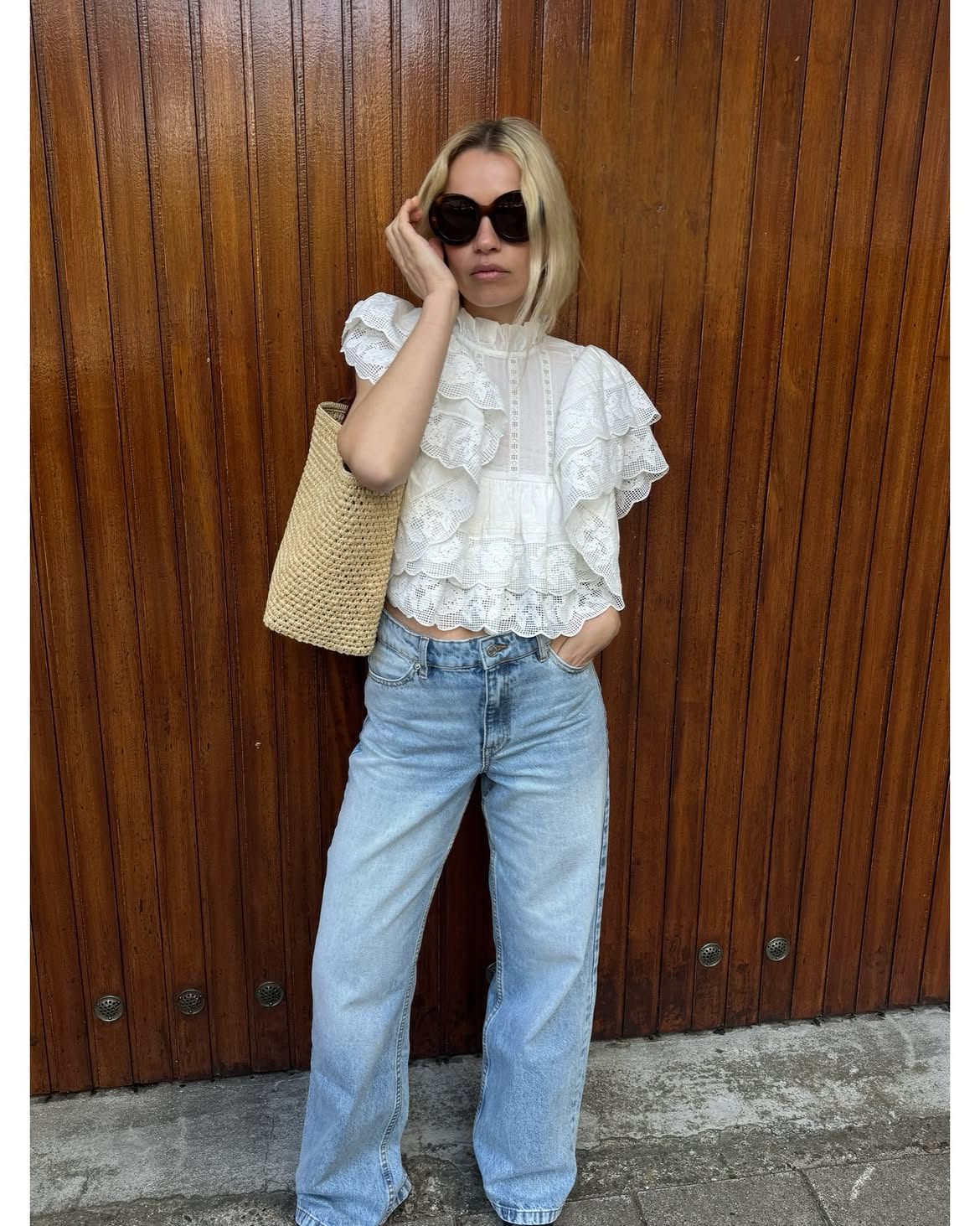 pretty white eyelet top with jeans and shorts outfit
