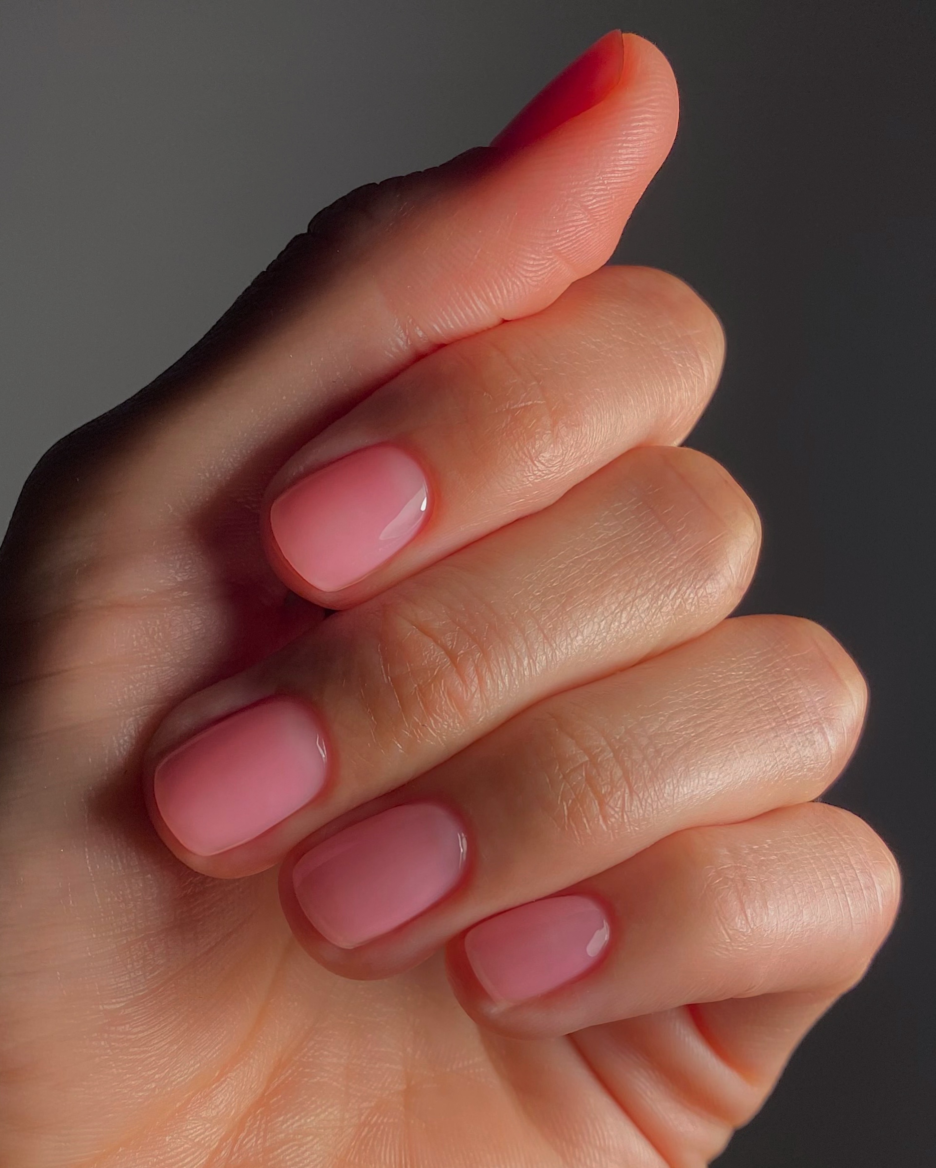 A picture of a sheer pink manicure created by @matejanova