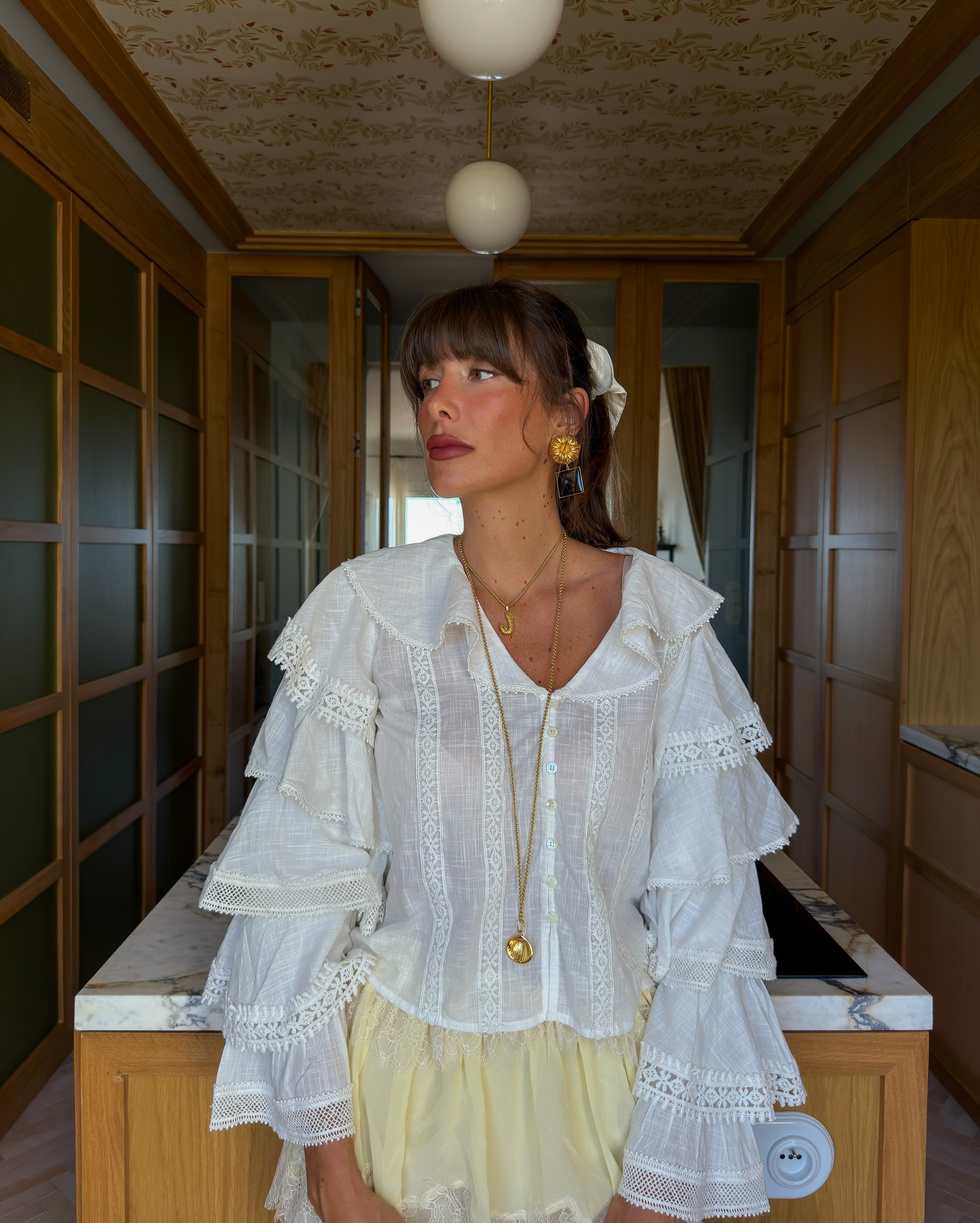 Julie wearing white Sezane blouse