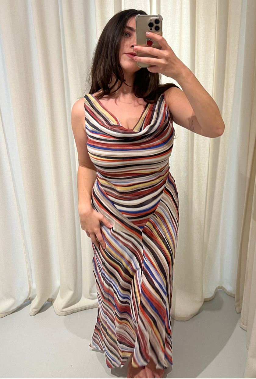 An image of Ava Gilchrist, Realisation Par, wearing the Cora dress. She is wearing it in a size M.
