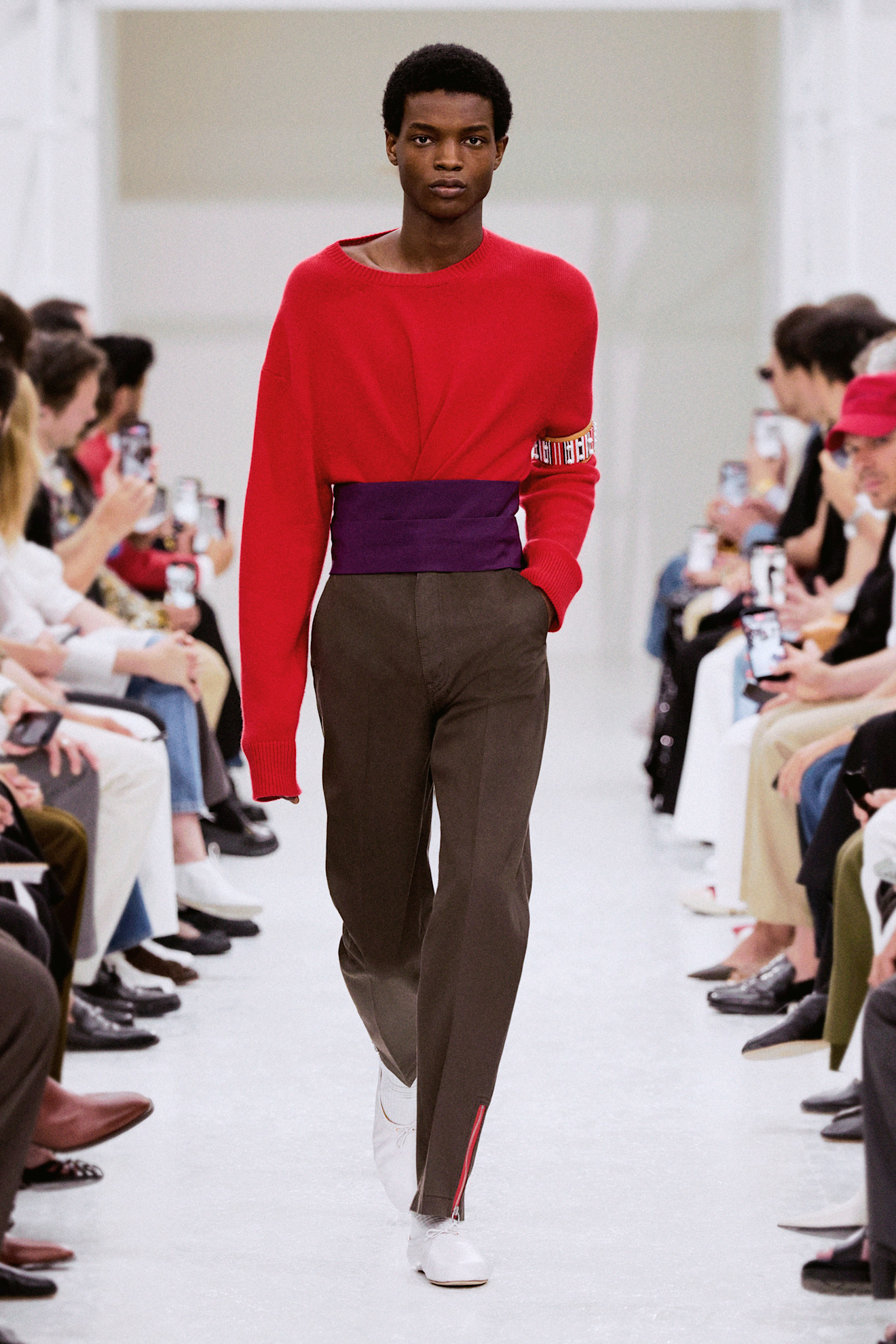 An image of the purple and red colour trend on the Celine Spring 2027 mens runway.