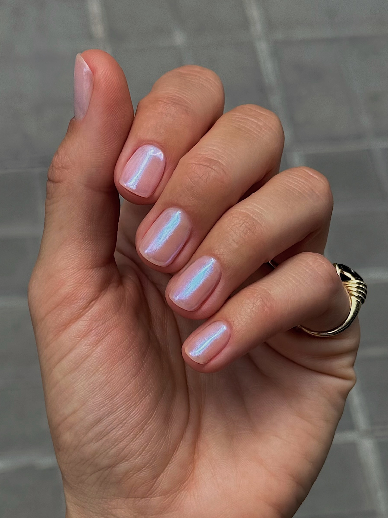 A sheer chrome nail design.