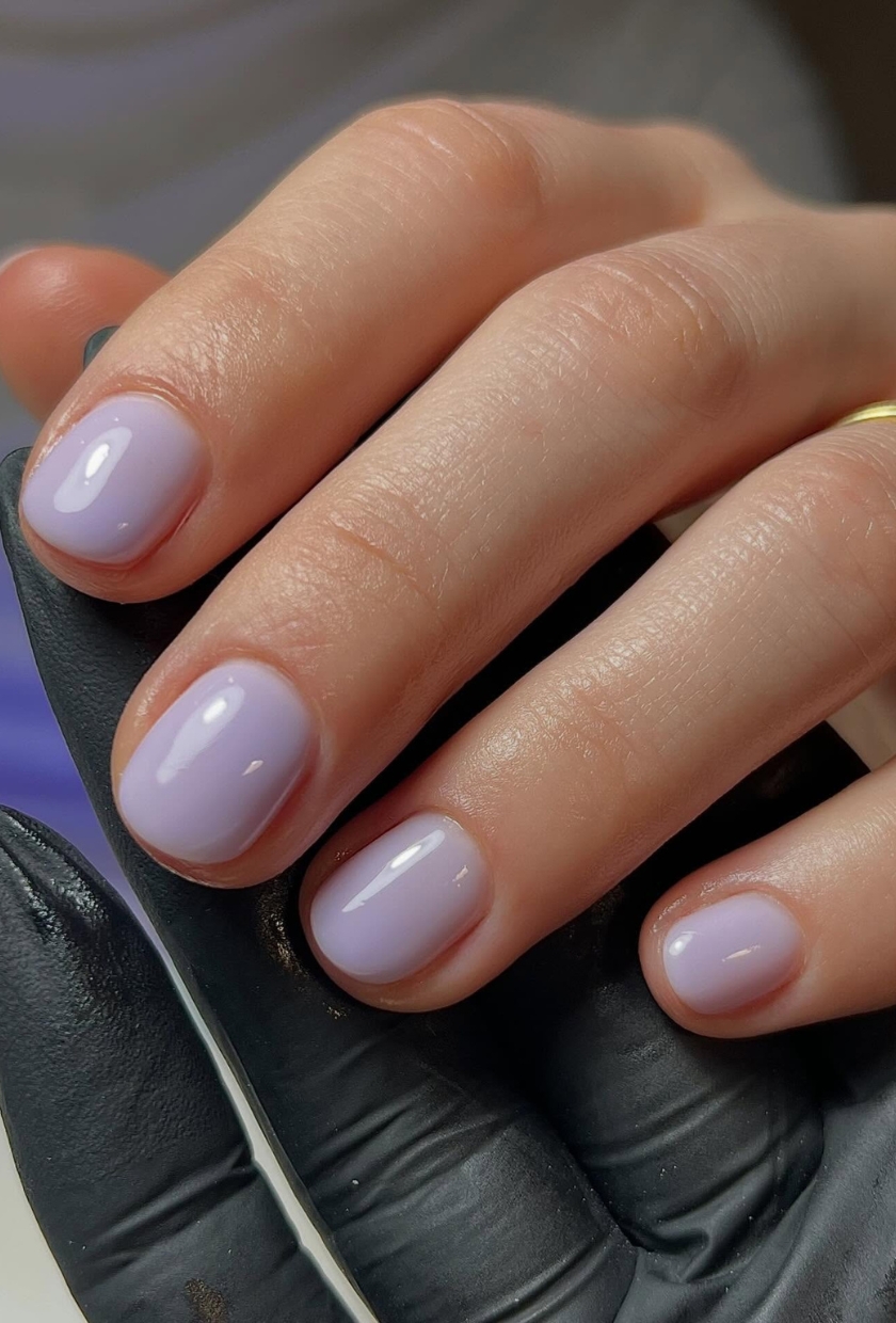 A close up shot of mauve milk nails