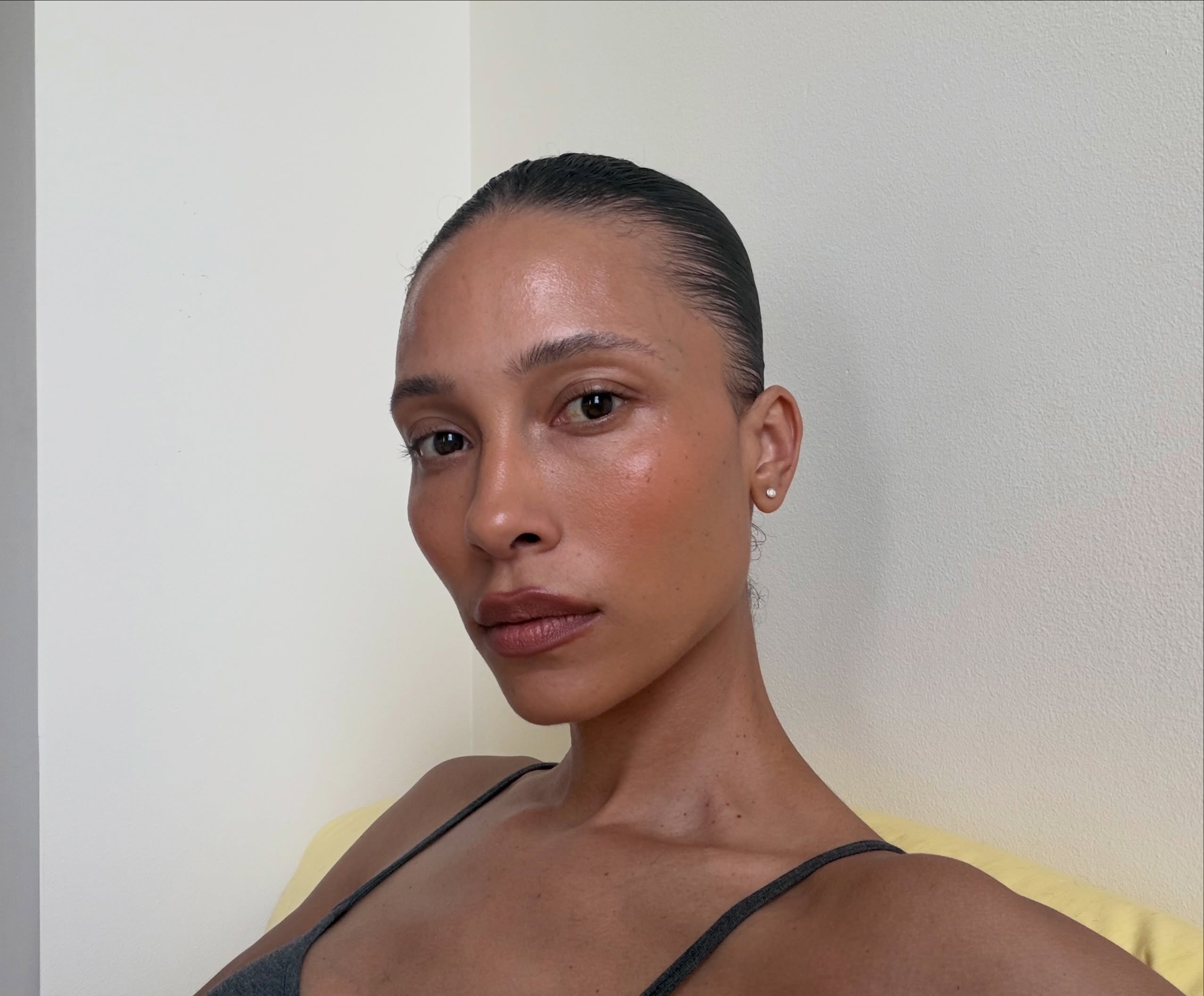 Creator @tylynn taking a selfie with glowing skin