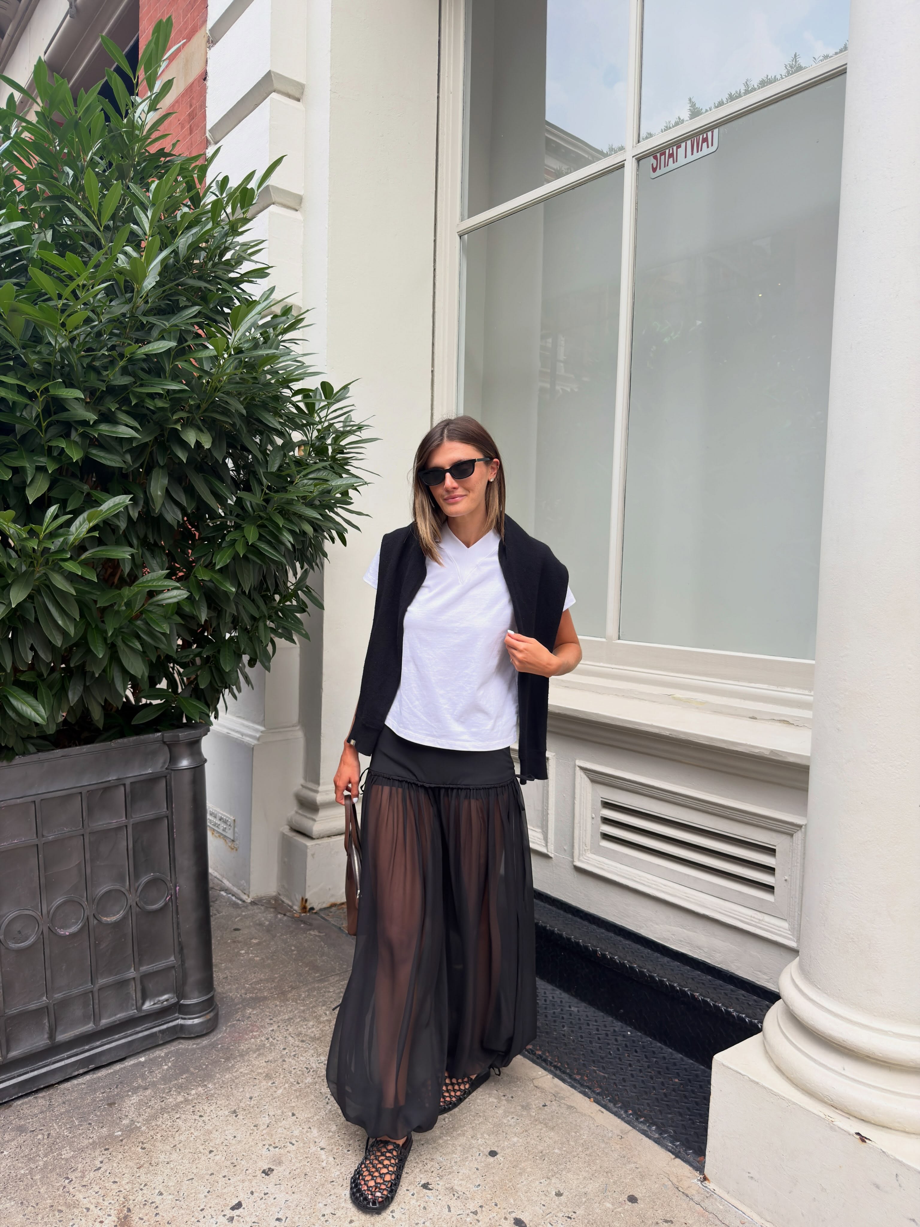 An image of a woman wearing non jeans fall outfit idea 2026