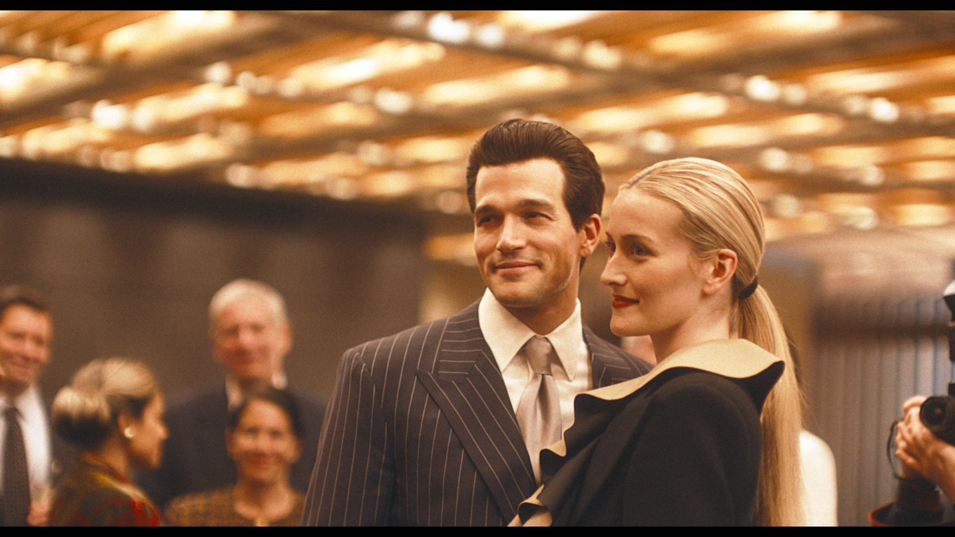 Sarah Pidgeon and Paul Anthony Kelly as John F. Kennedy Jr. and Carolyn Bessette in Love Story. Pidgeon is wearing a Yohji Yamamoto look.