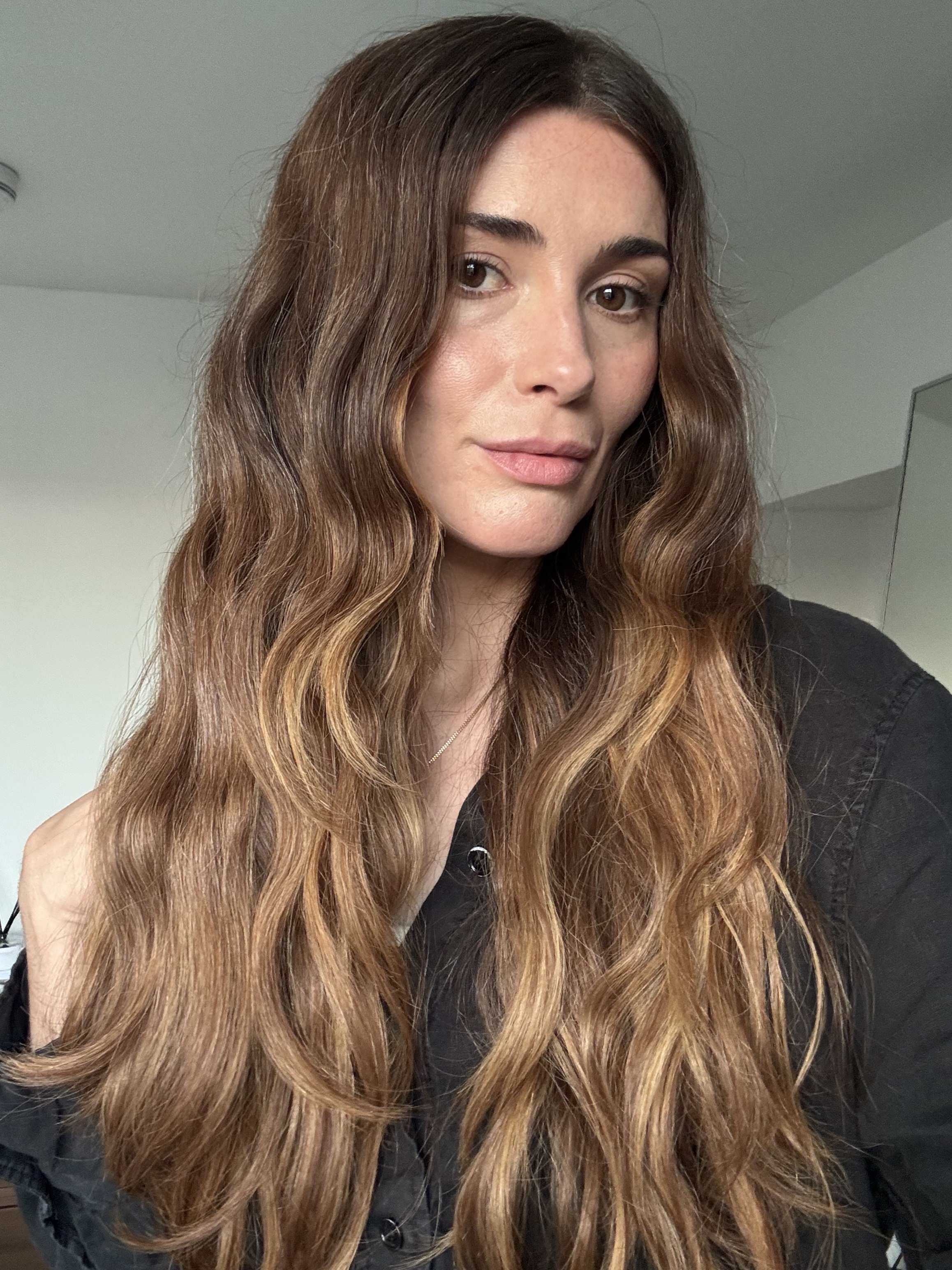 a photo of beauty editor Eleanor Vousden with beachy waves