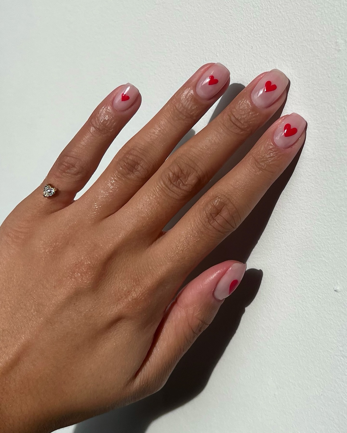 Photo of a red nail design with micro nail art