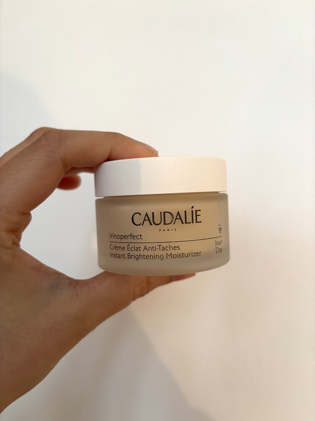 Mica Ricketts holding Caudalie Vinoperfect moisturiser