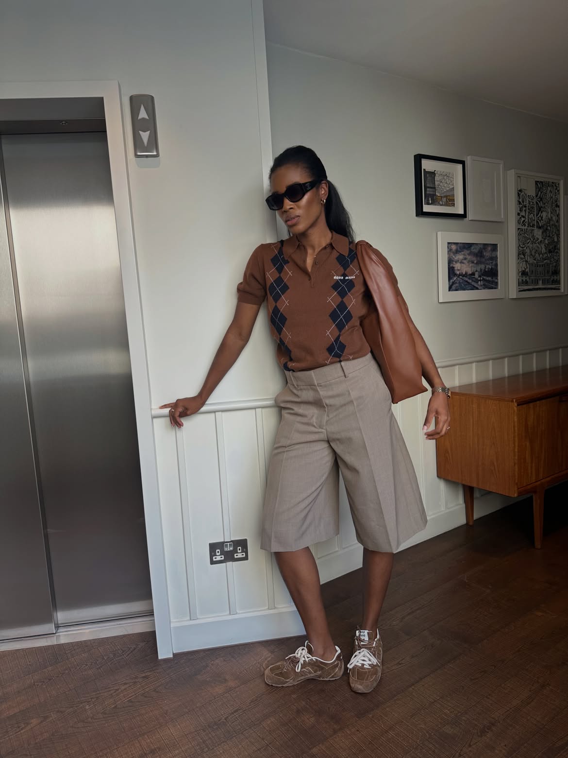 Knitted polo shirt and tailored shorts.