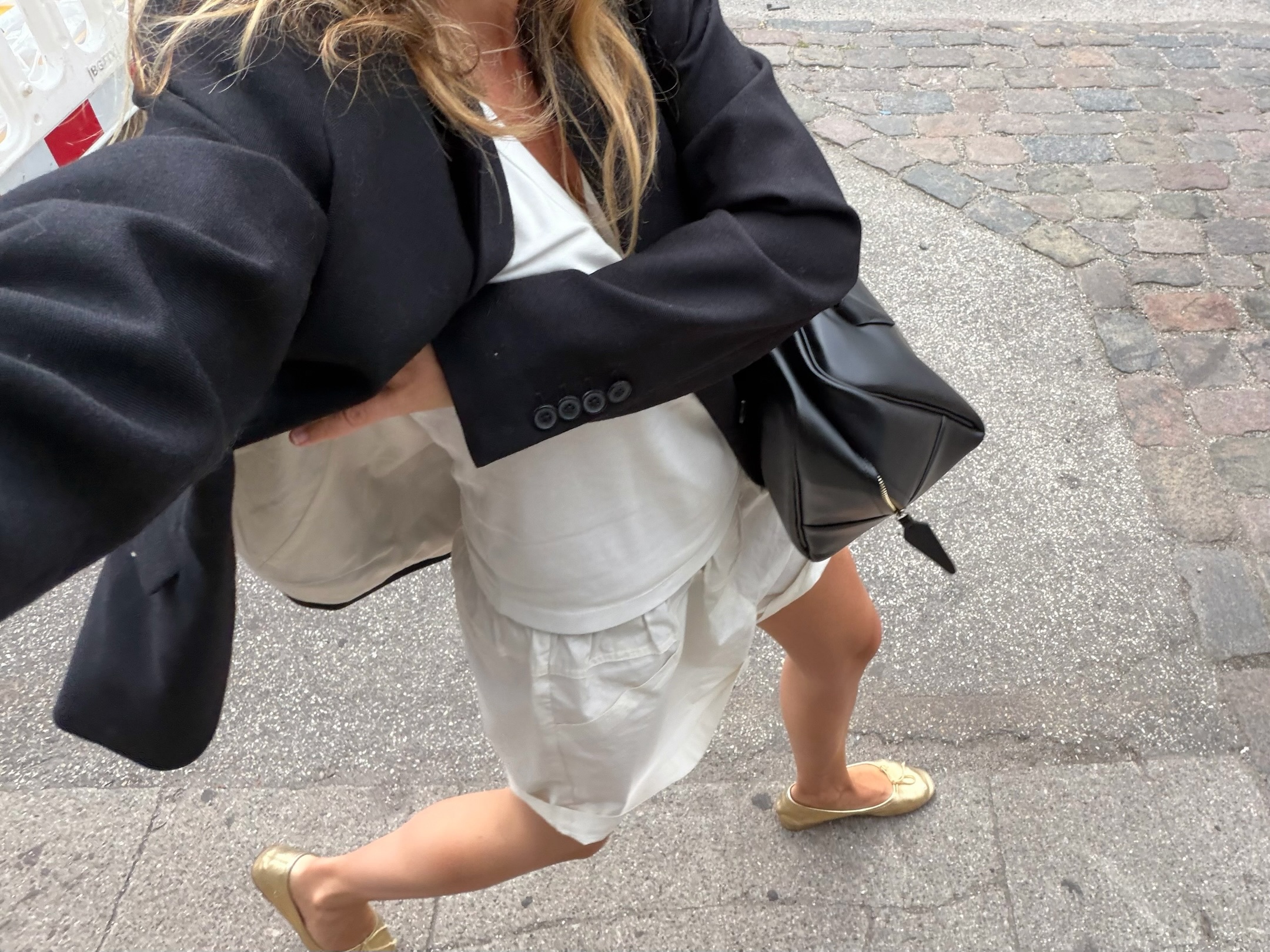 An image of a woman wearing metallic ballet flat trend
