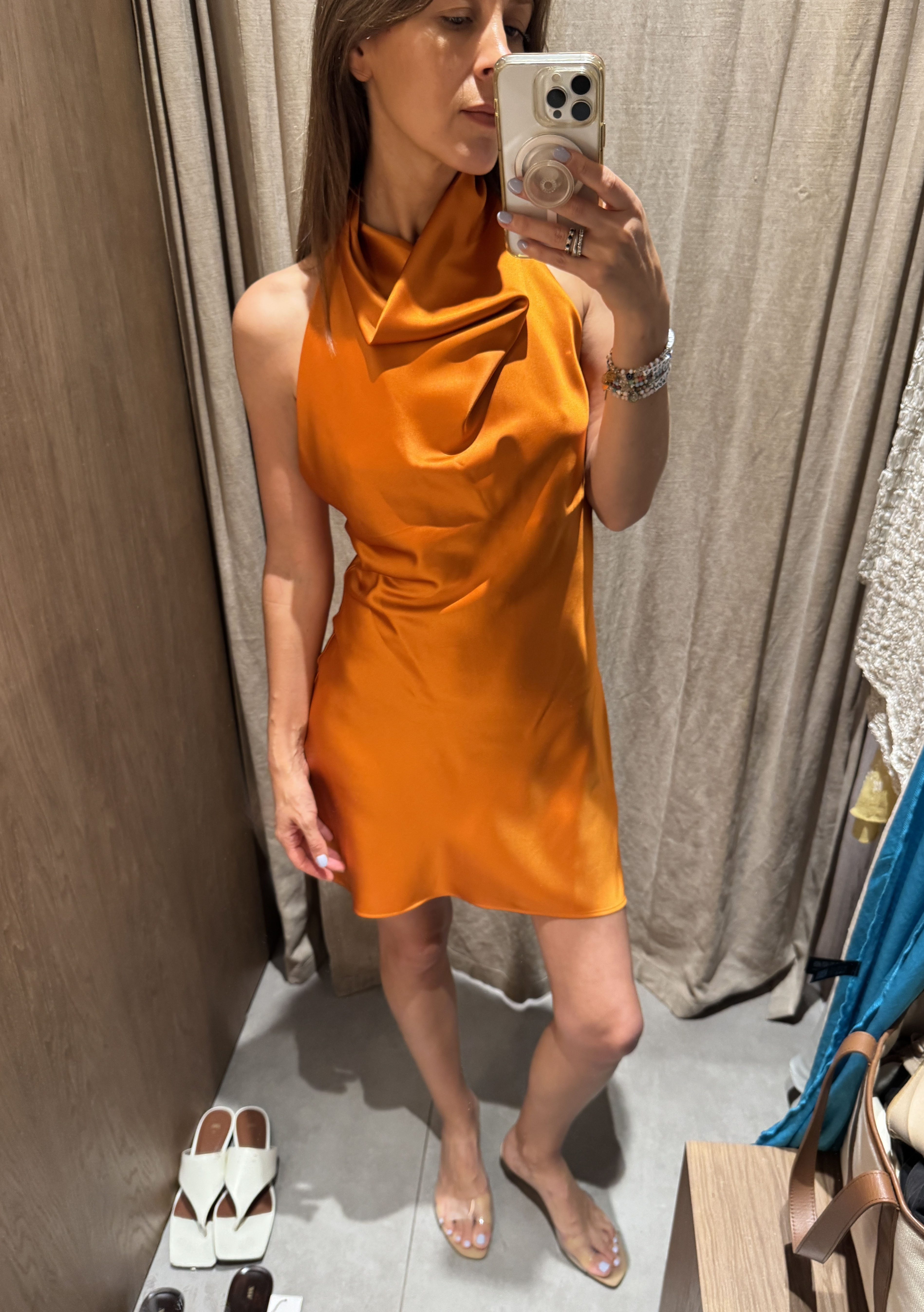 Judith Jones in an orange satin dress