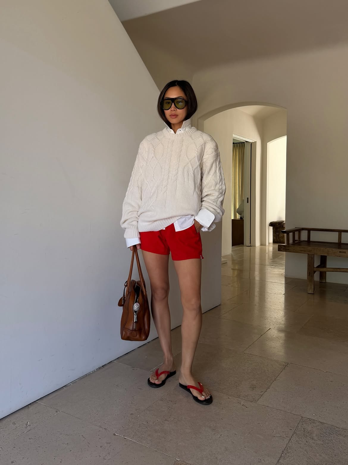 Aimee wearing jumper and shorts