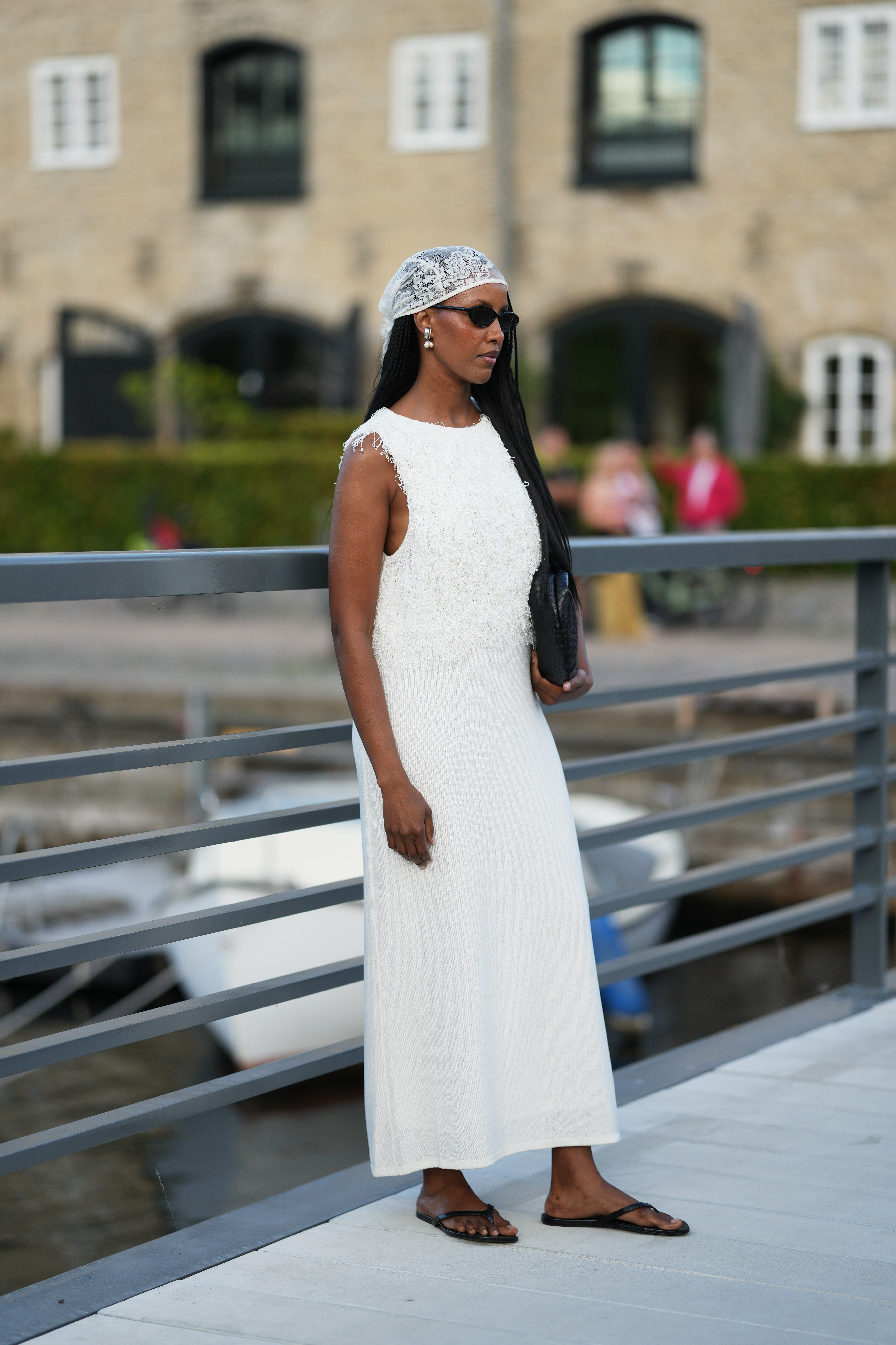 Woman wearing white dress at Copenhagen Fashion Week Spring Summer 2027.