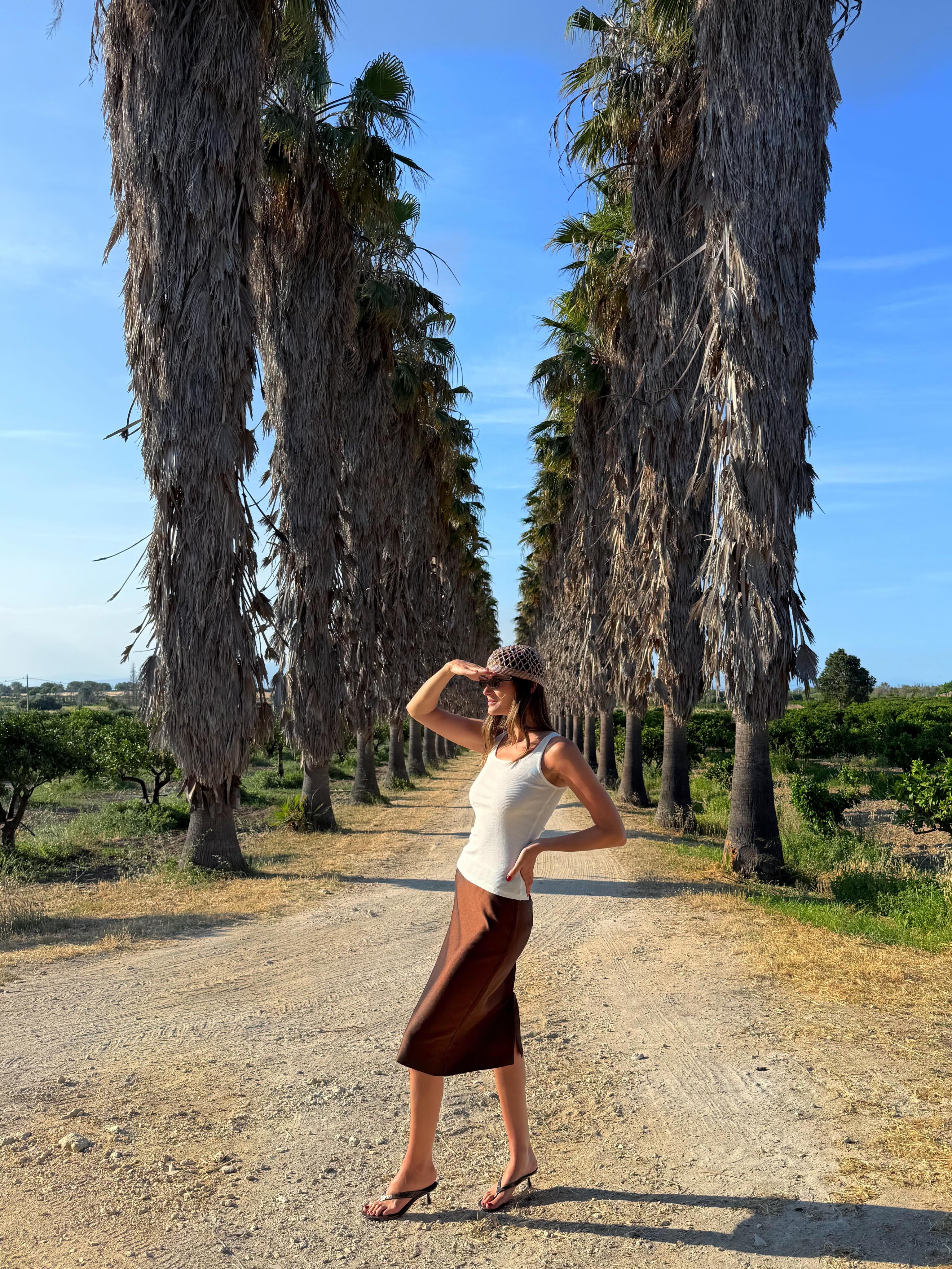 An image of @cocoschiffer  wearing a crochet skull cap, one of the biggest hat trends of 2026.