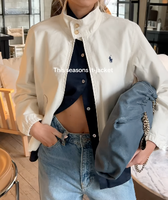Woman wearing a Polo Ralph Lauren jacket.