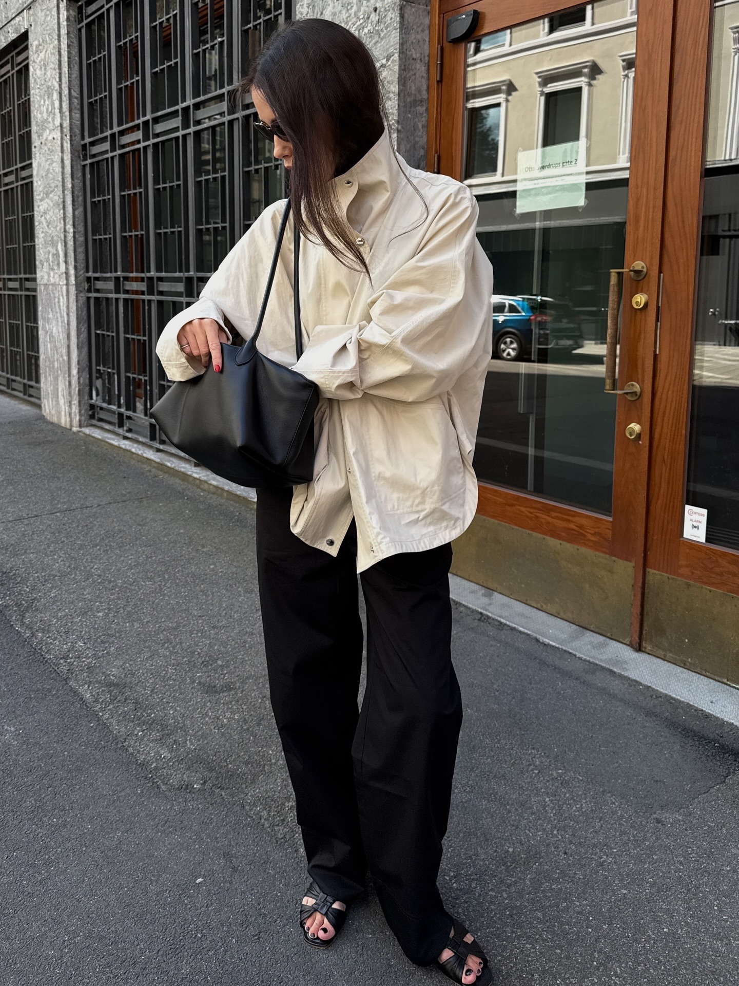 Woman wears cream jacket and black trousers