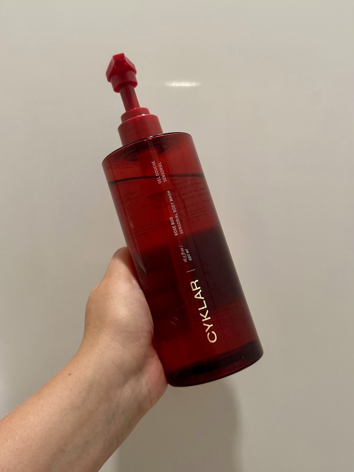 Beauty Editor Kaitlyn McLintock holding Cyklar Rosebud Body Wash