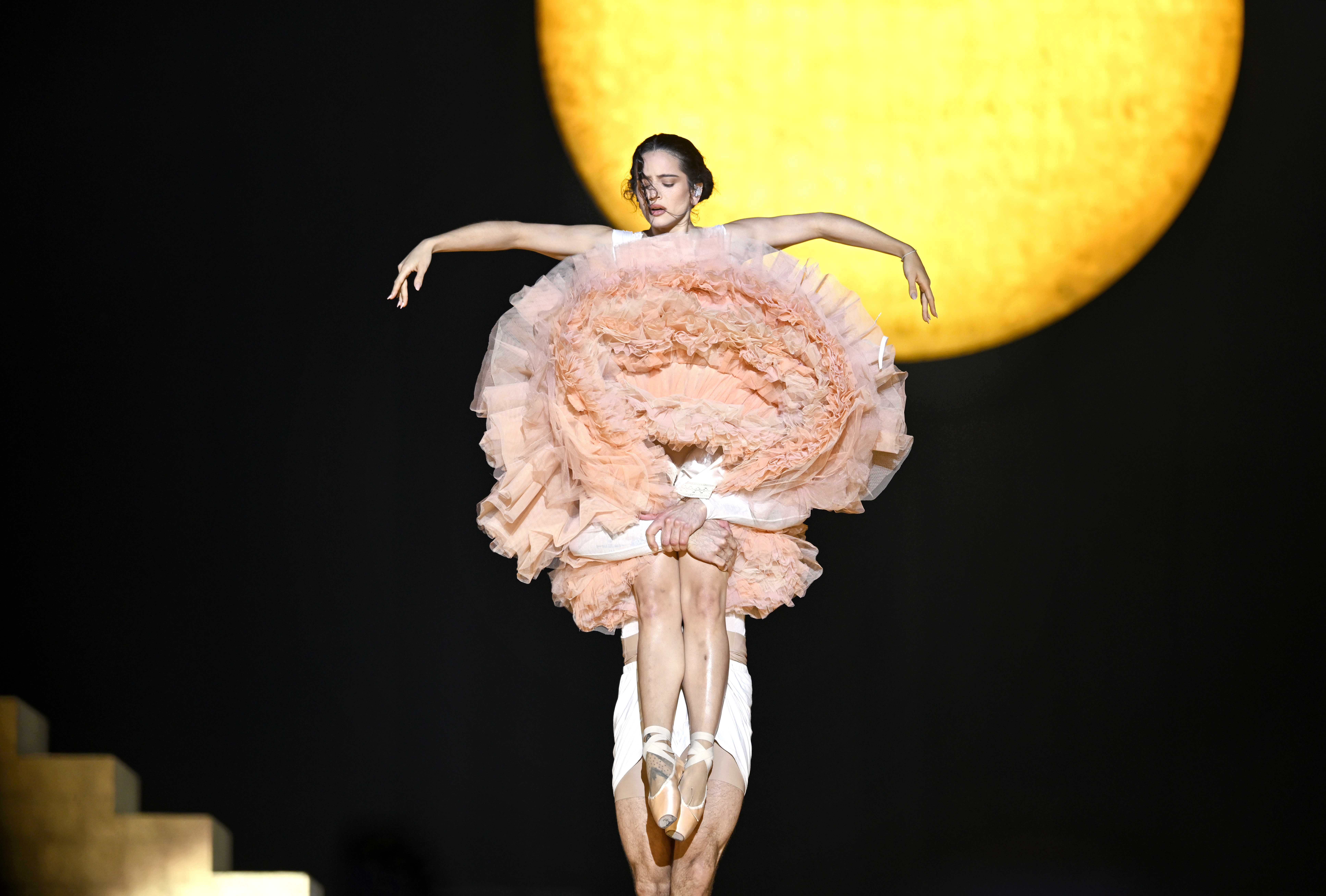 Rosalia in concert wearing tulle ballet outfit