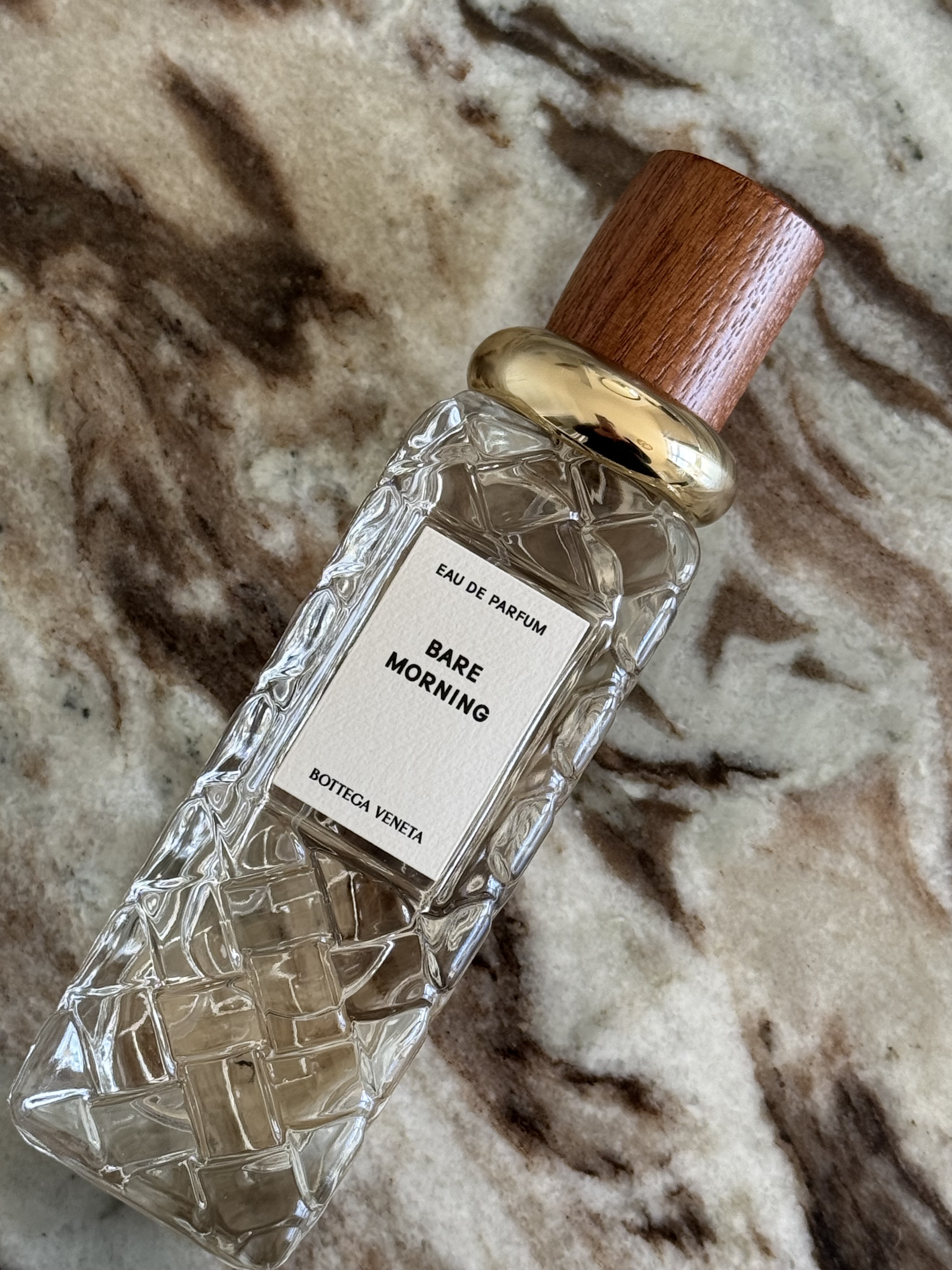 A close-up of the Bottega Veneta Alta Bare Morning perfume bottle