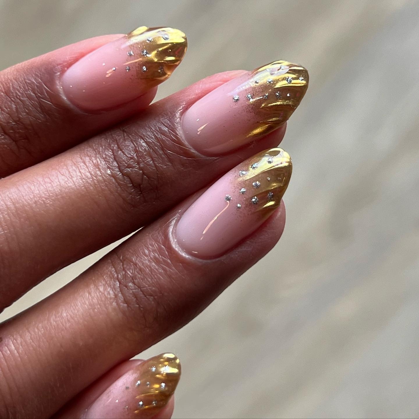 A gold French tip manicure