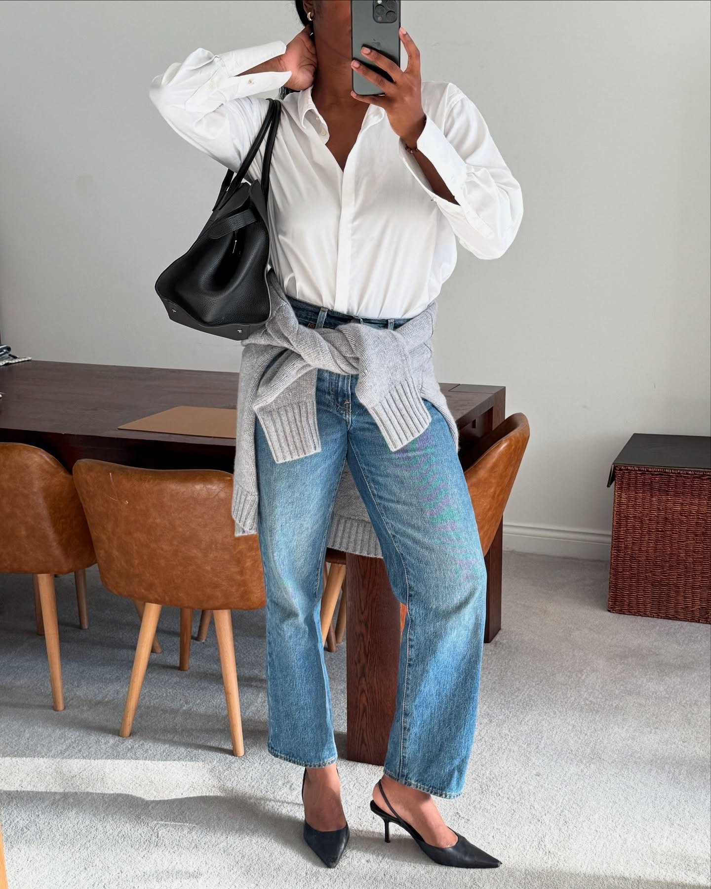 @nlmarilyn in jeans and a white button-down.