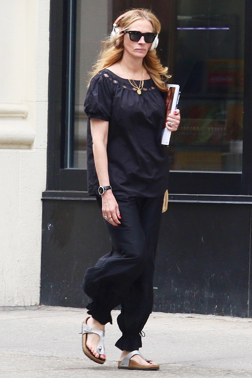Julia Roberts wearing a black puff-sleeve top with balloon pants and silver Birkenstock Gizeh sandals in NYC