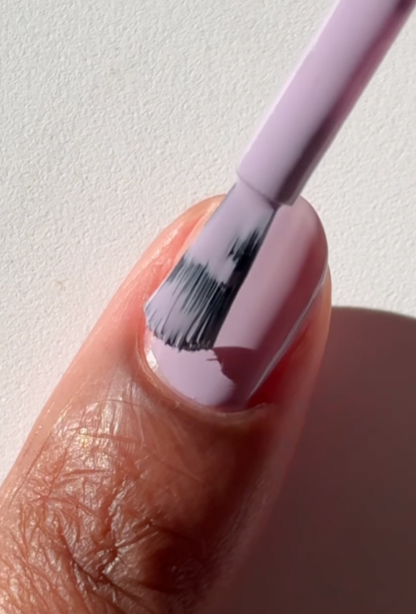 A close up shot of mauve milk nails