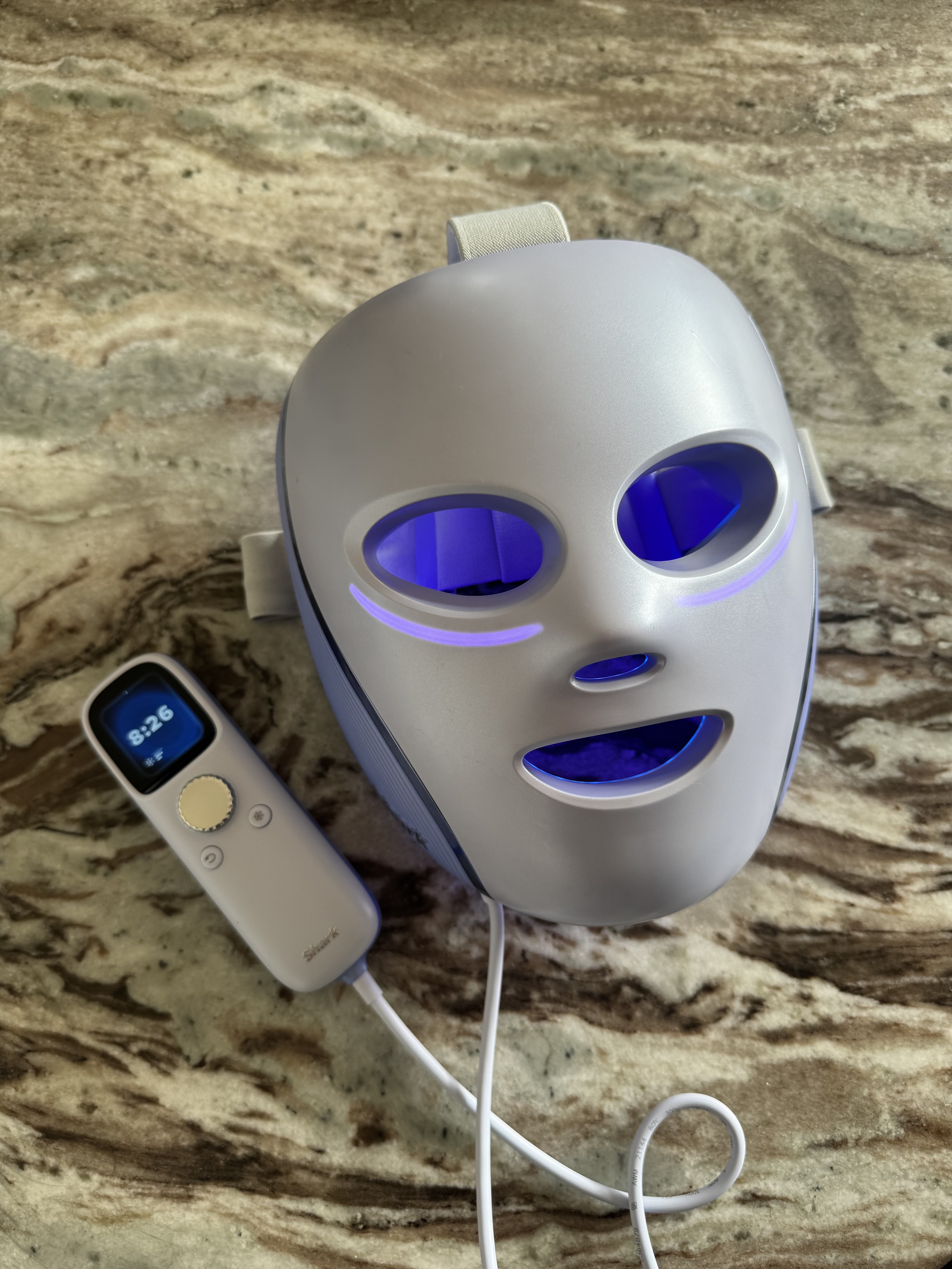 The new Shark CryoGlow Plus LED mask on a marble table