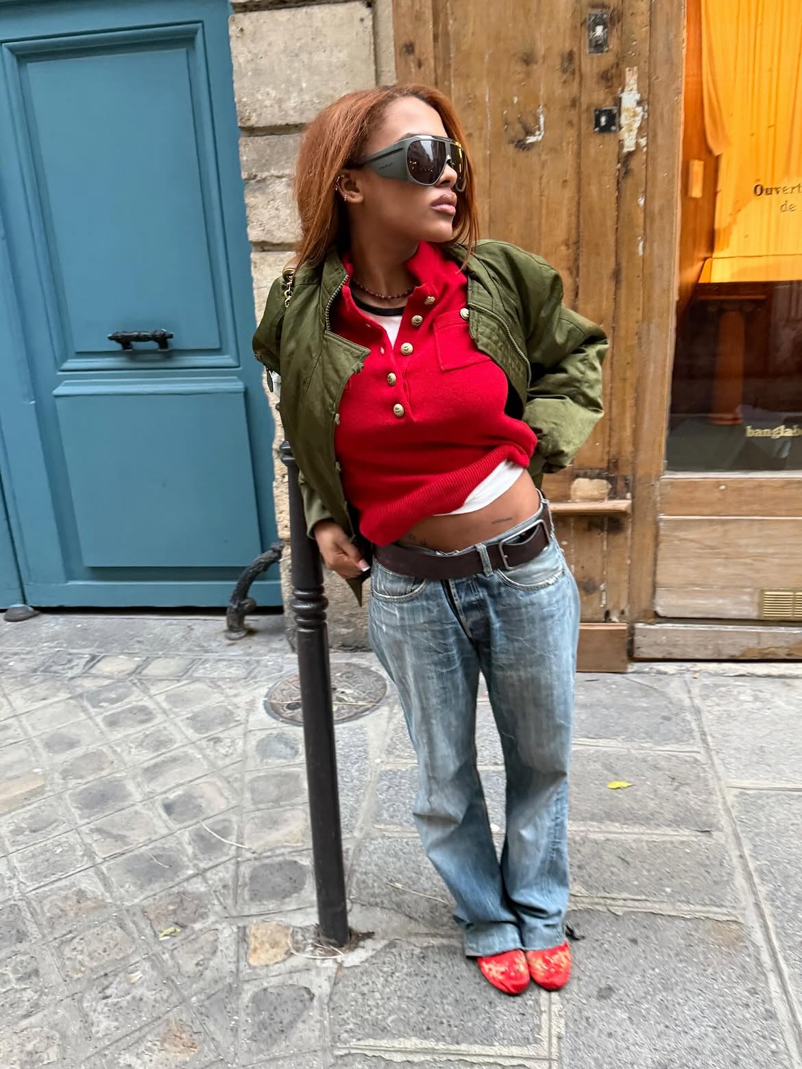 Jeans with red knit and shoes.