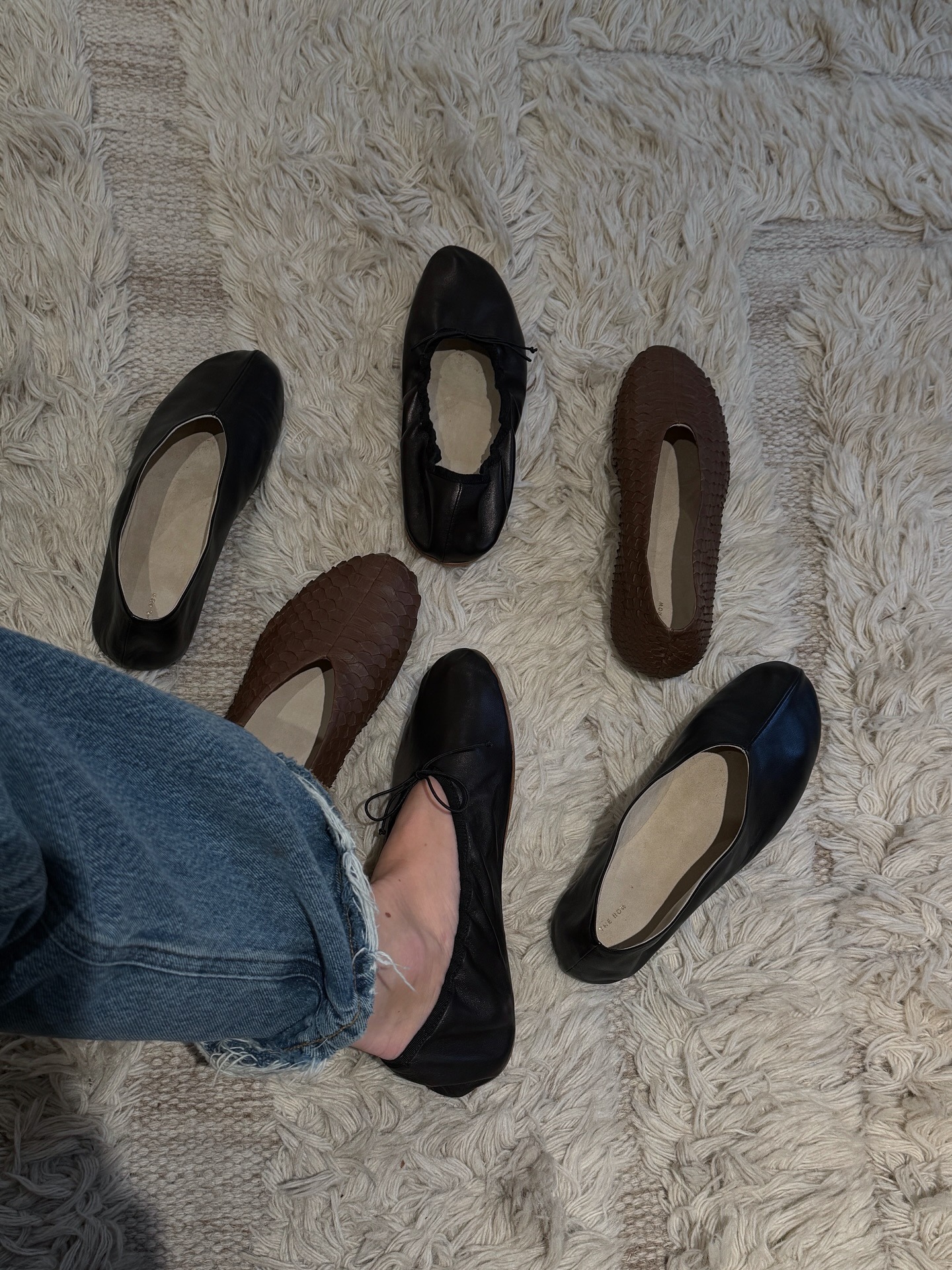 Woman wears The Row Stella ballet flats