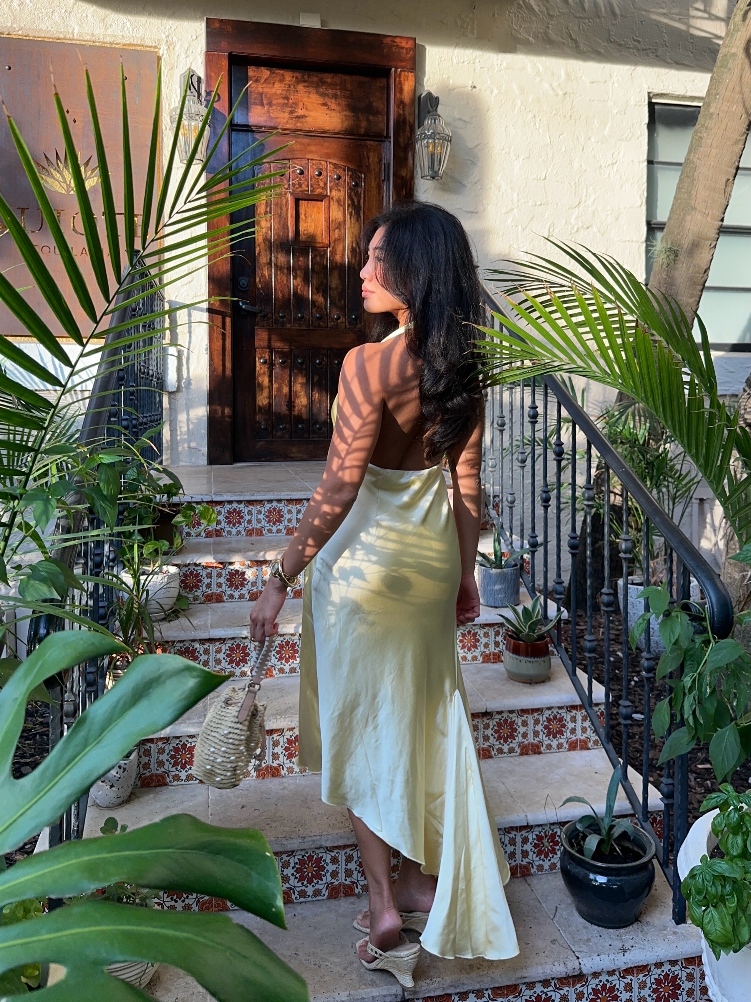 An image of a woman wearing skinny wedge sandals