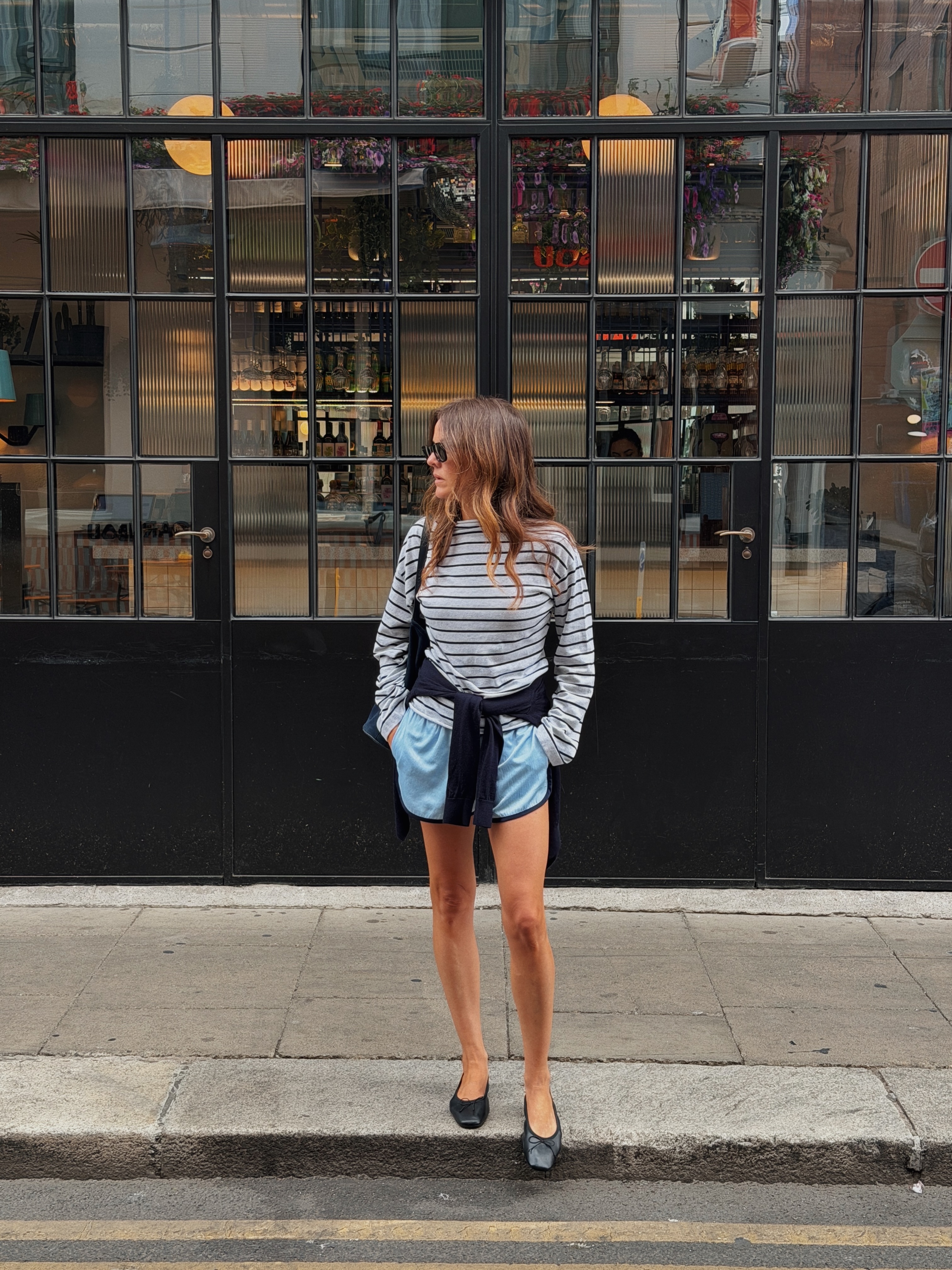 An image of a woman wearing early fall trendy outfit idea 2026