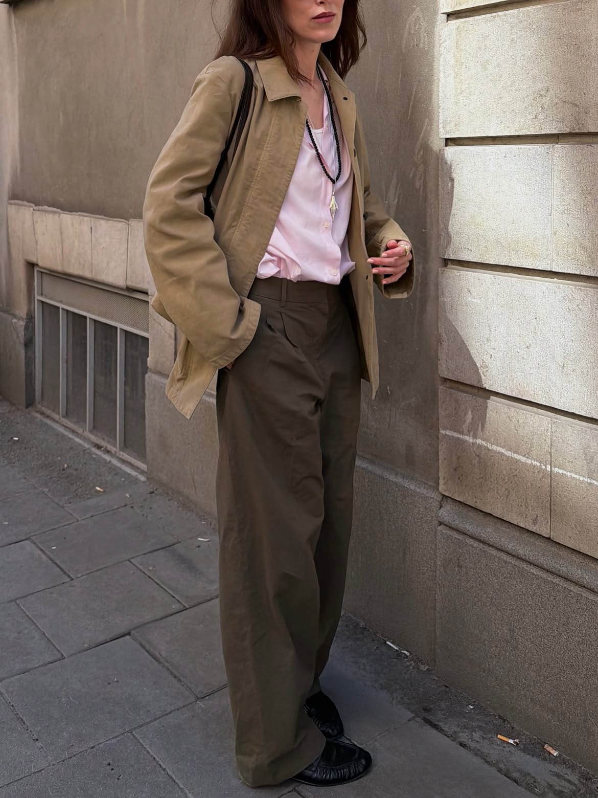 Annabel wearing shirt and trousers