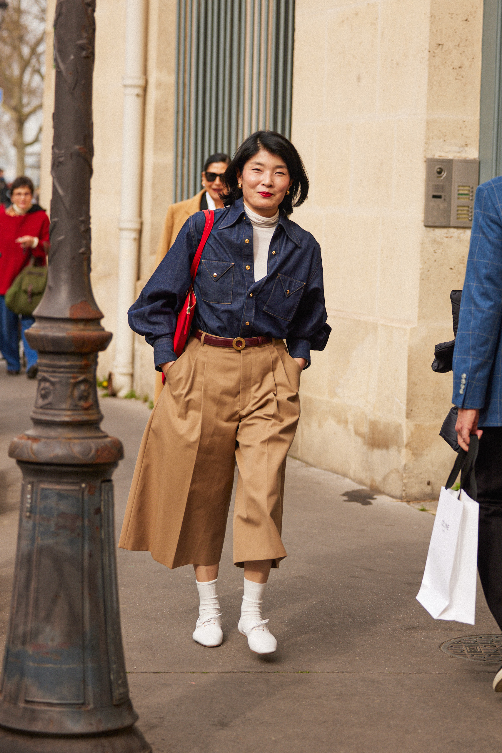 a Paris fashion week attendee wearing Celine derby shoes