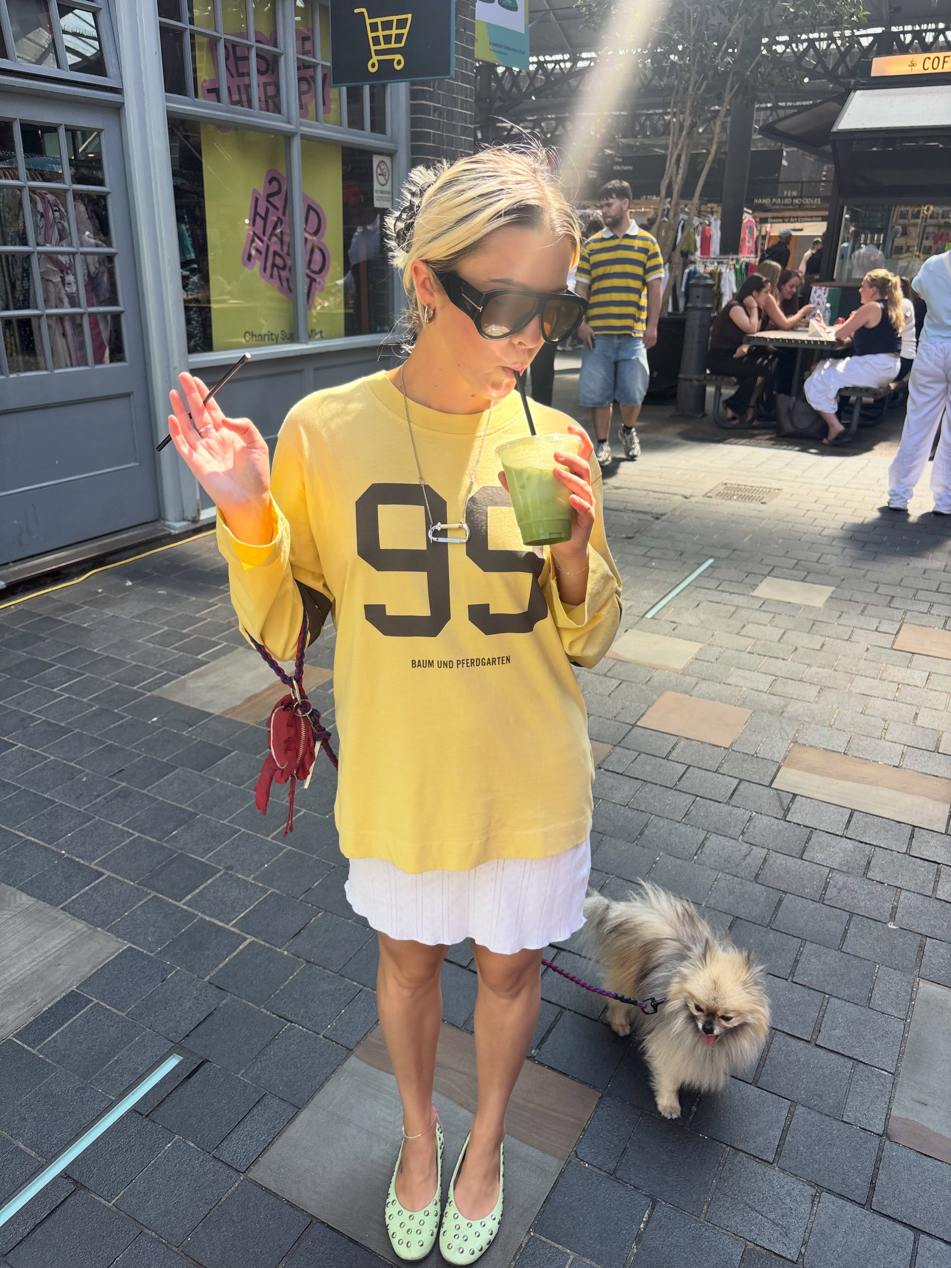 Influencer Elsie Matilda wearing a yellow numbered long sleeve t-shirt.