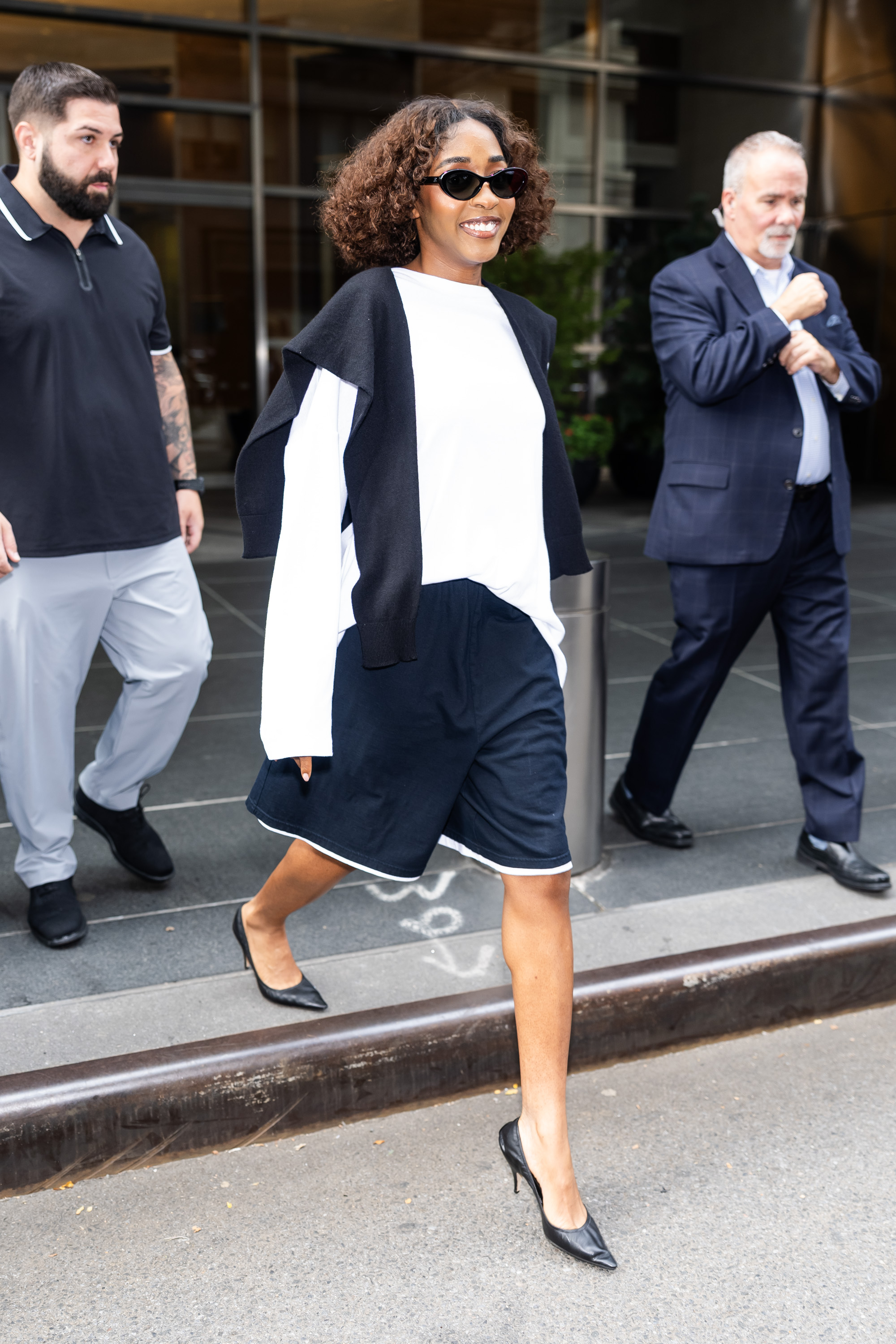 An image of Ayo Edebiri wearing long shorts.