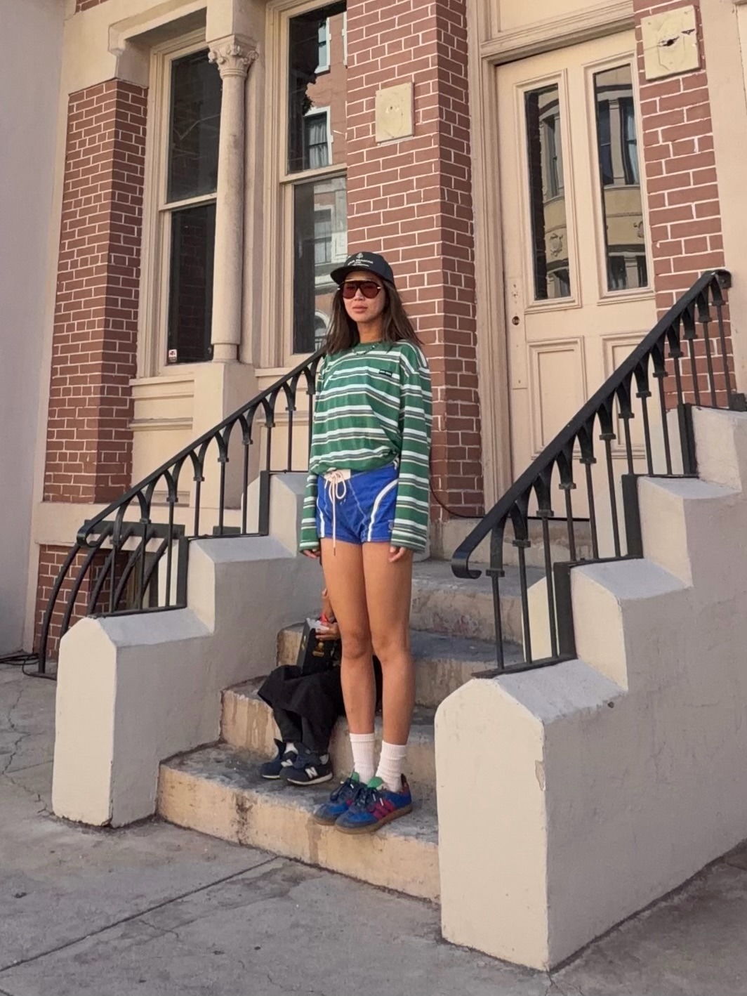 Woman in sporty shorts and sneakers