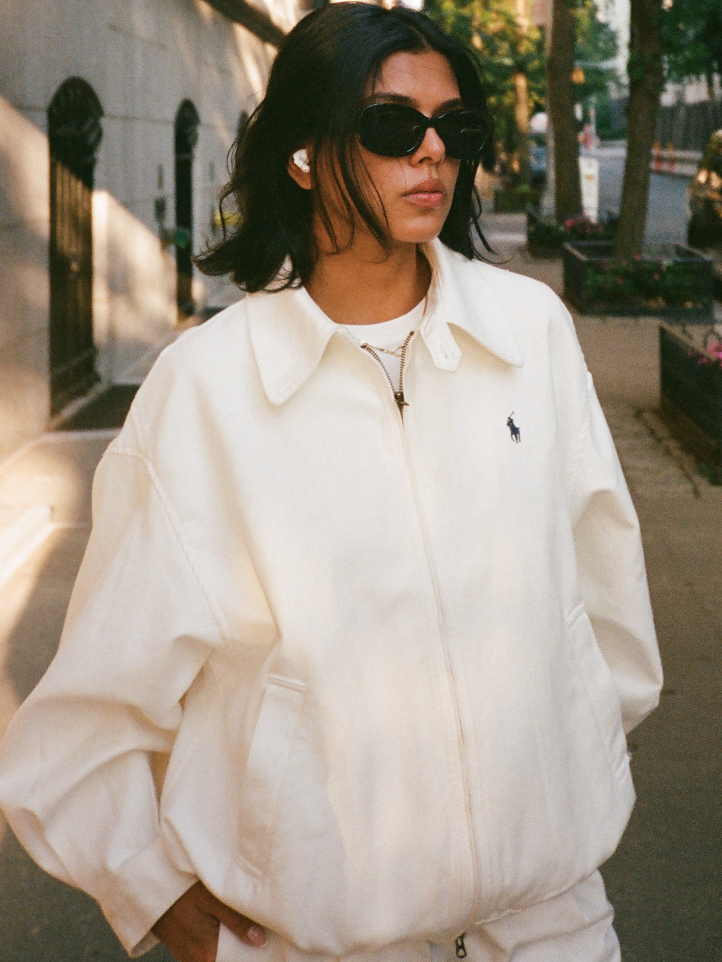Woman wearing a Polo Ralph Lauren jacket.