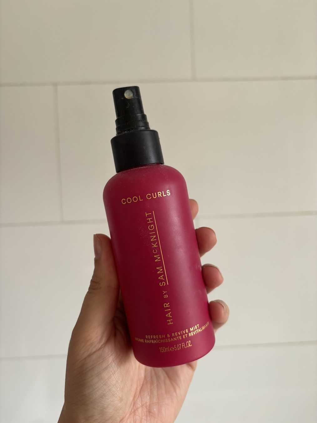 Mica Ricketts holding Hair by Sam McKnight Cool Curls Refresh & Revive Mist