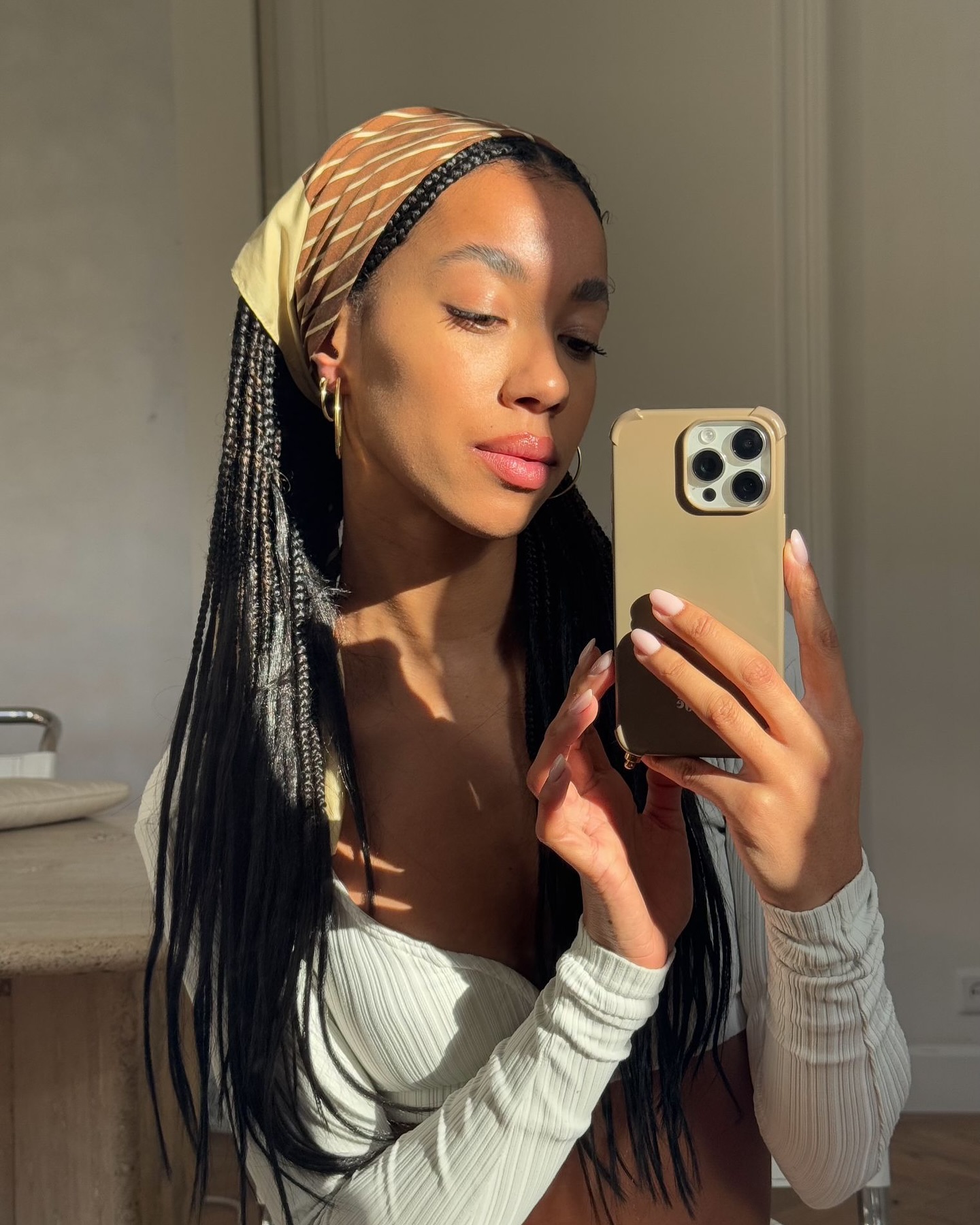 Amaka Hamelijnck with braids and headscarf - best products for hyperpigmentation