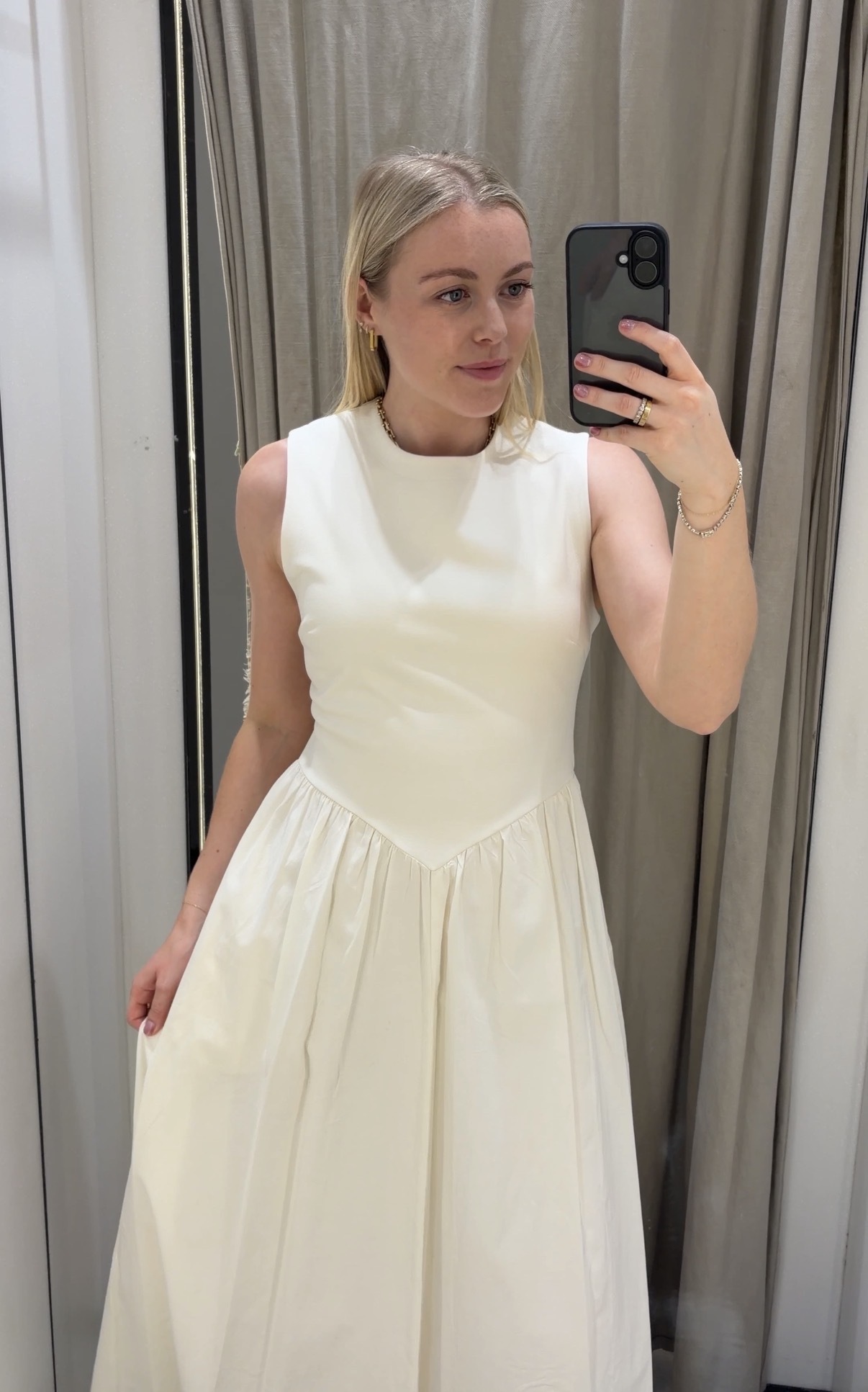 florrie wears a white dress from Zara
