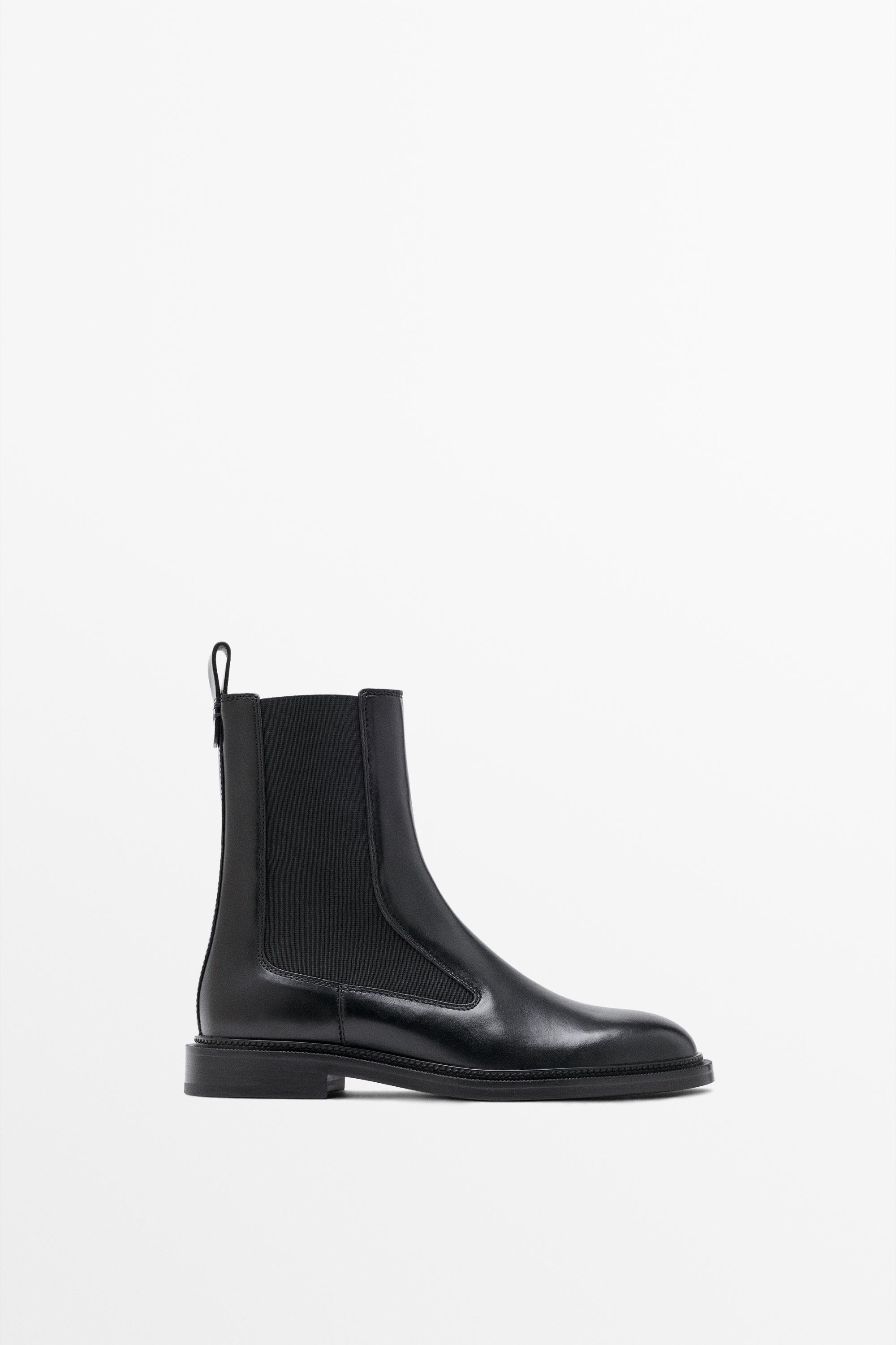 An image of a black leather Chelsea boot
