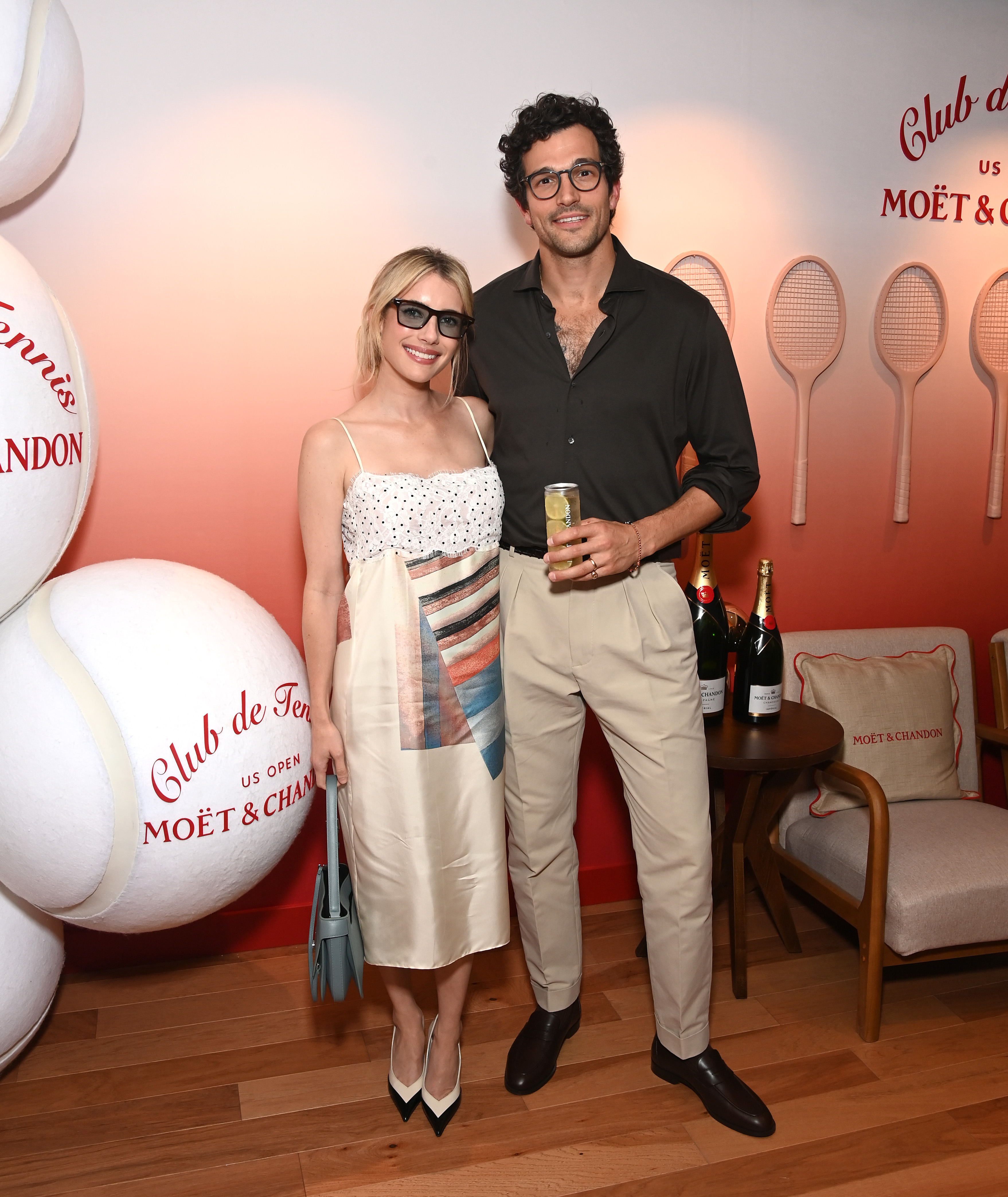 Mo&euml;t & Chandon hosts actors Paul Anthony Kelly and Emma Roberts at the Club de Tennis Suite at the US Open.