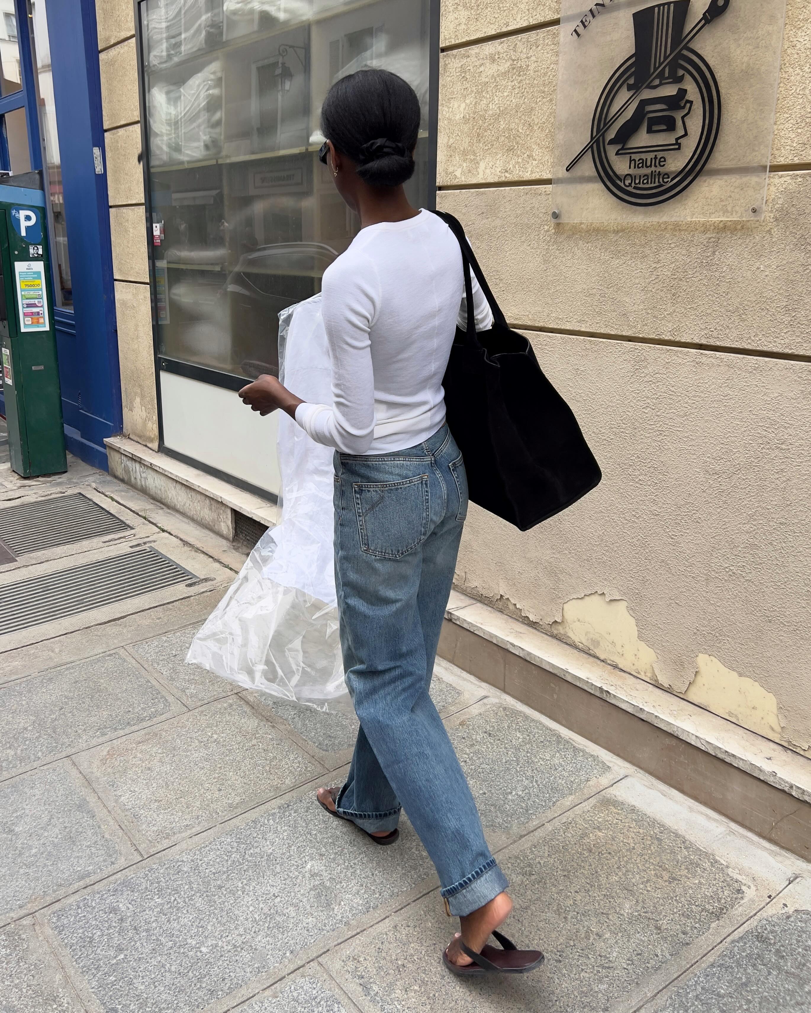 A woman wearing fall 2026 cuffed-jeans outfit idea.