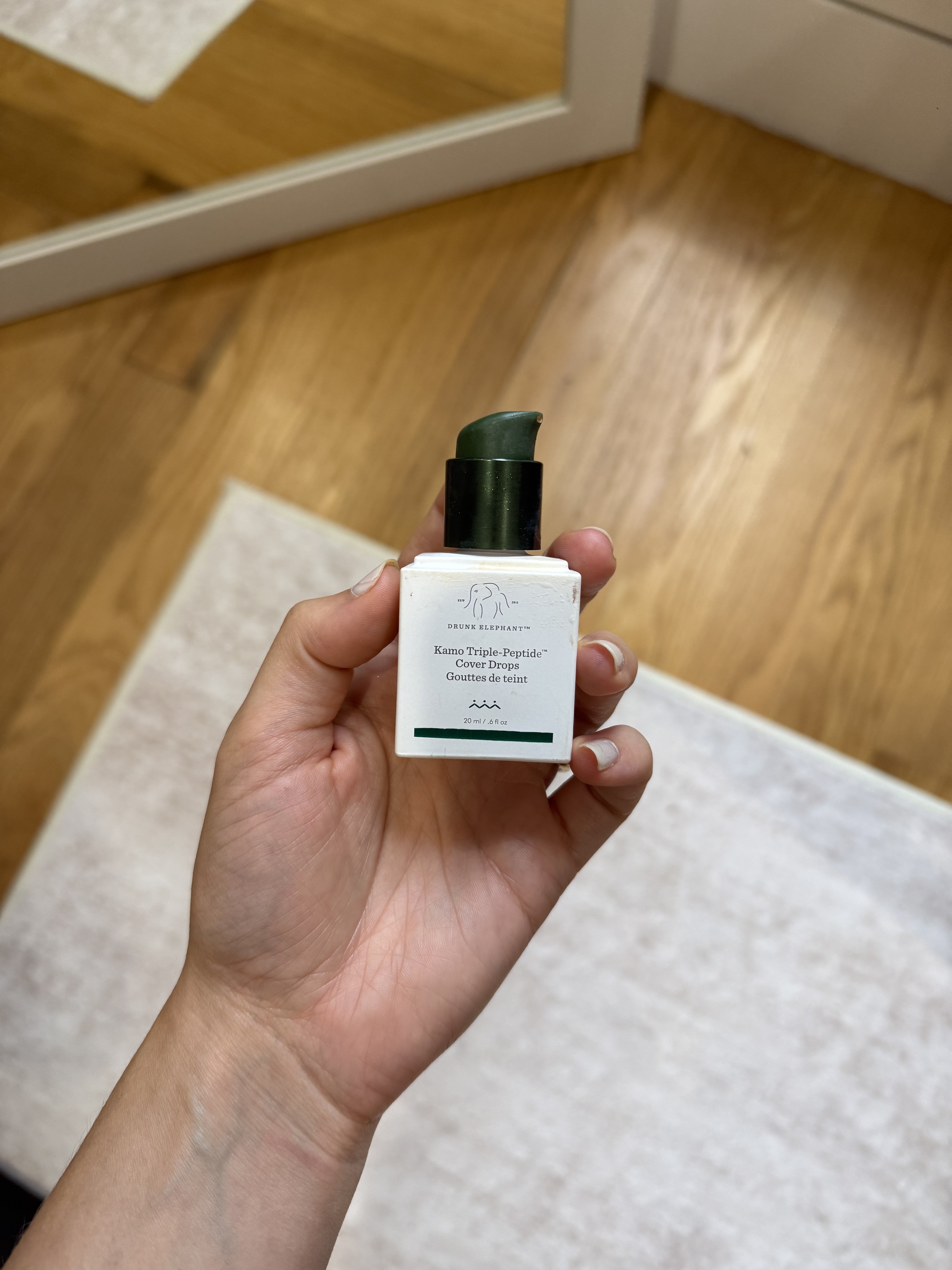 Photo of Jamie Chevron holding Drunk Elephant's new foundation