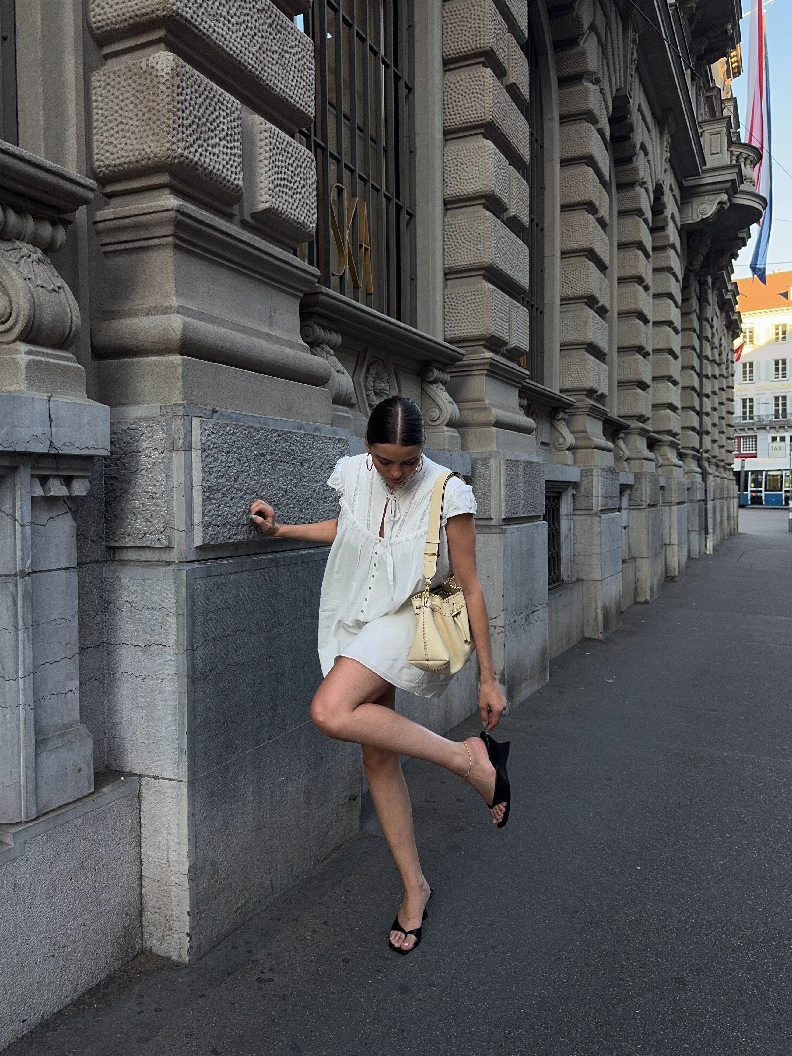 An image of a woman wearing skinny wedge sandals