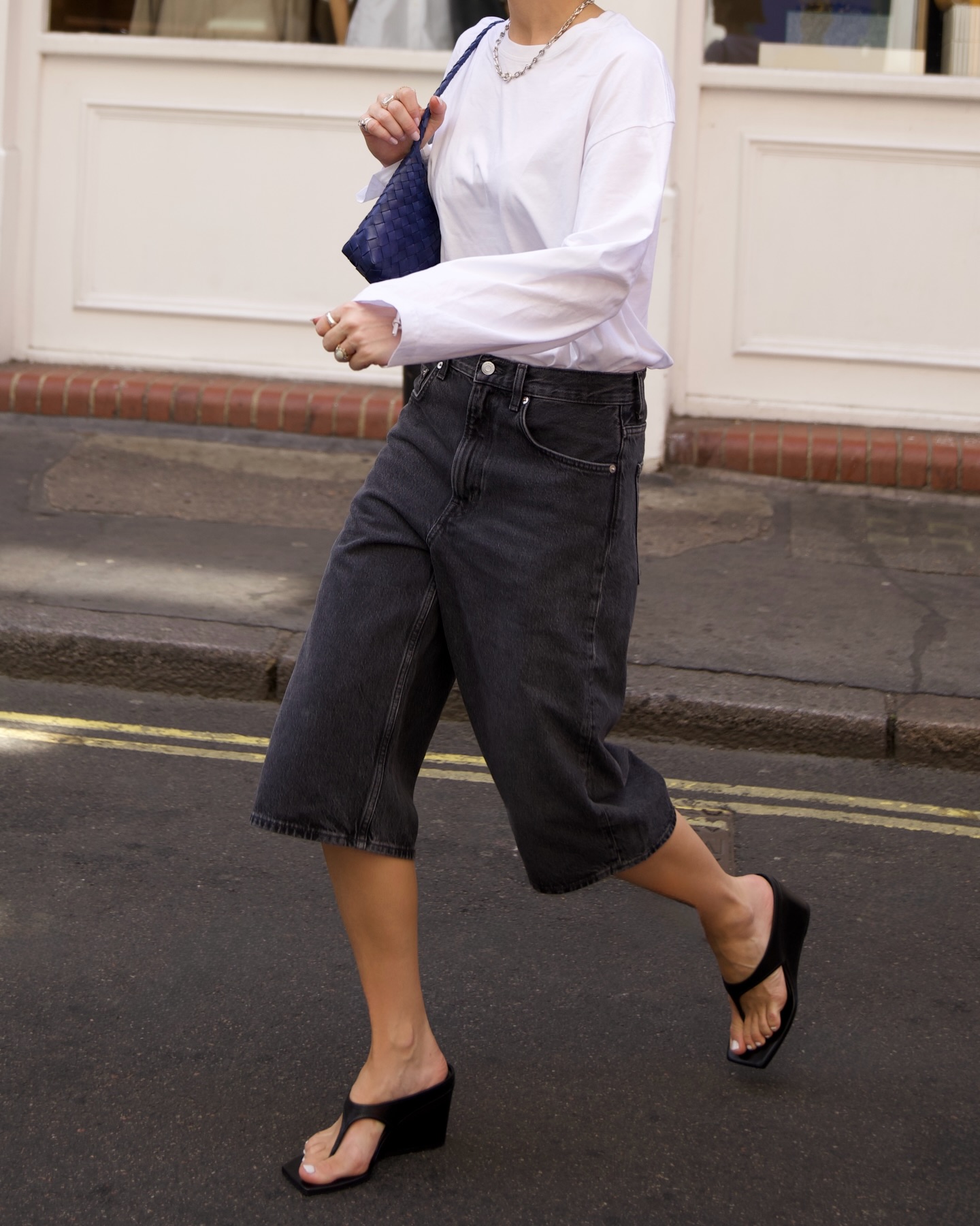An image of a woman wearing skinny wedge sandals