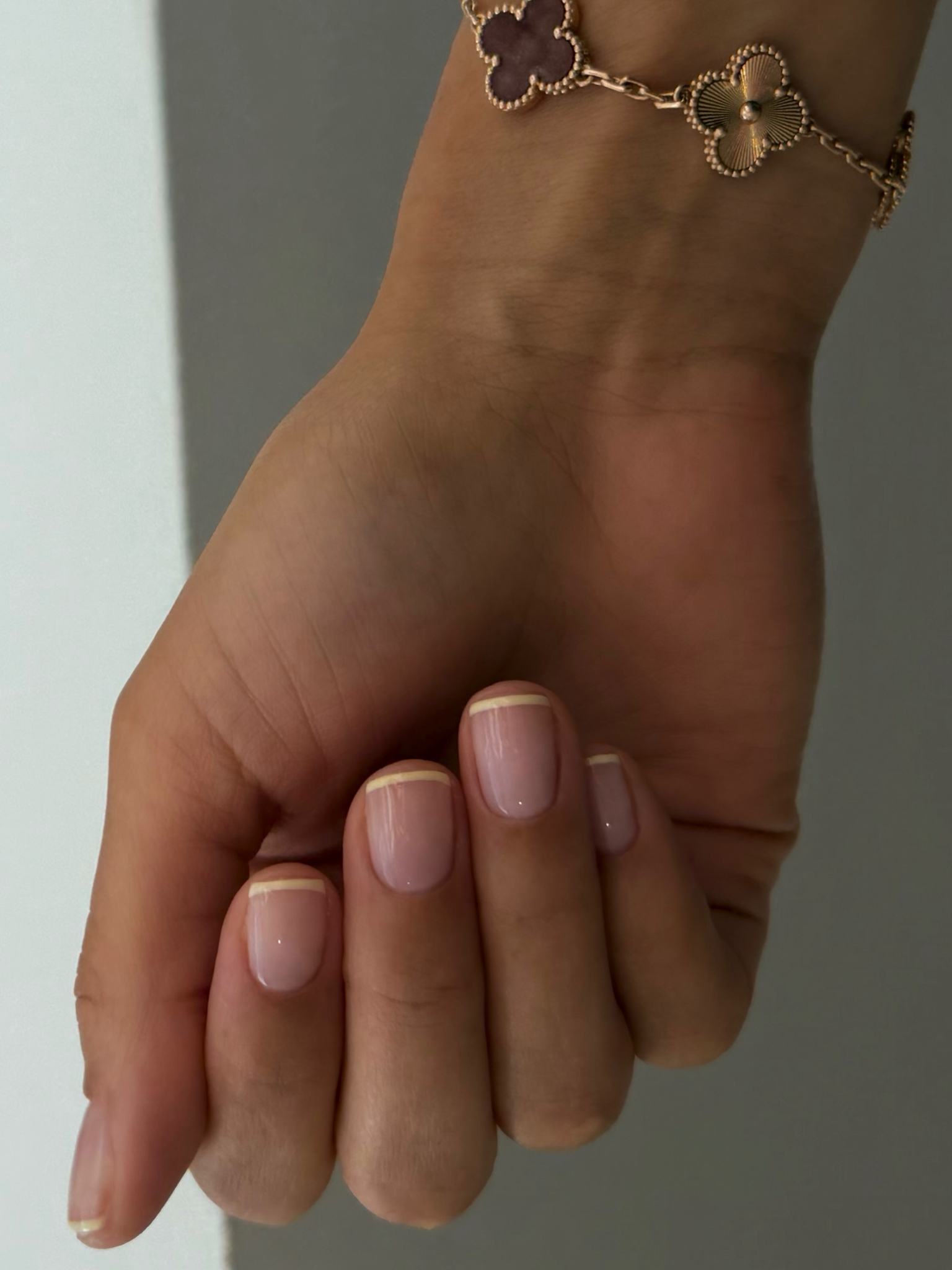 French tips in a butter yellow shade.