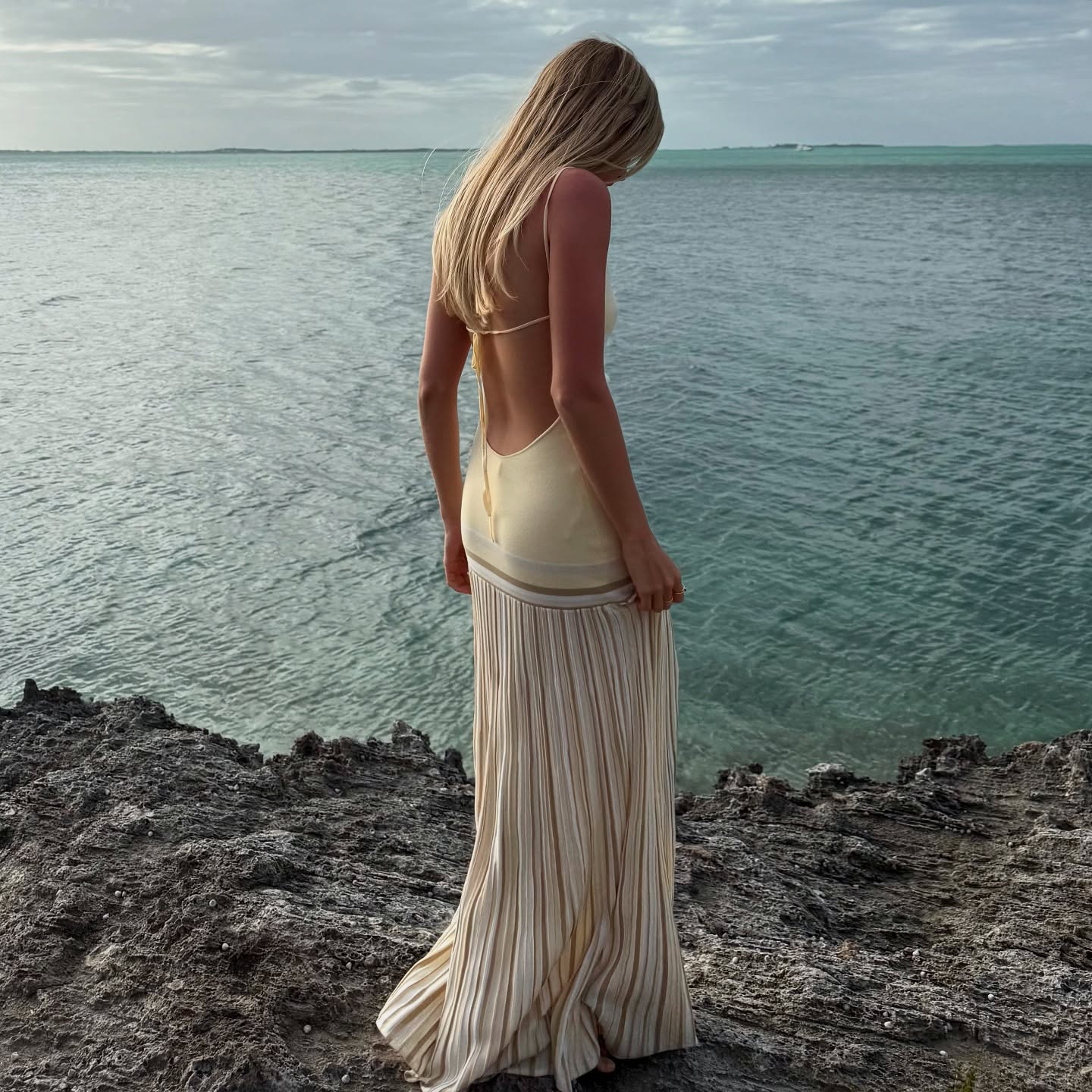 An image of @caitlinburnhamm wearing a stripe dress.